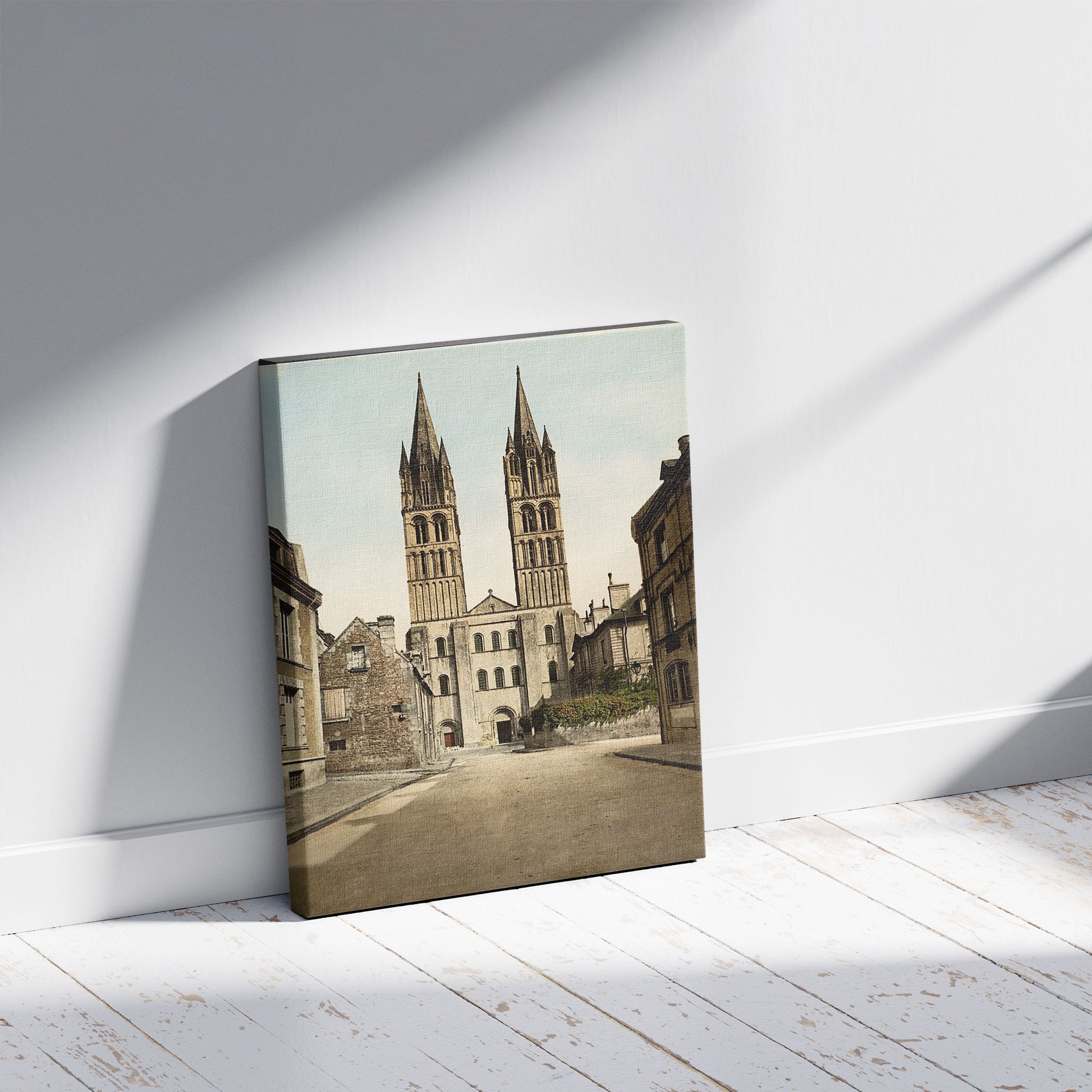 A picture of St. Etienne church, Caen, France, a mockup of the print leaning against a wall