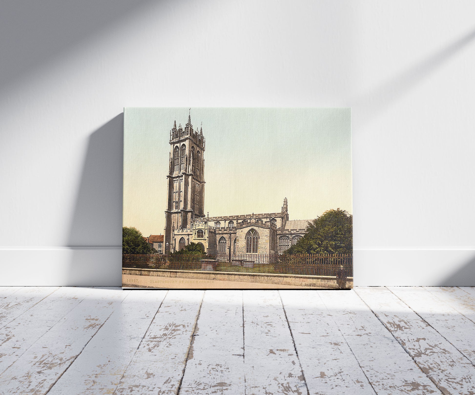 A picture of St. John's Church, Glastonbury, England, a mockup of the print leaning against a wall