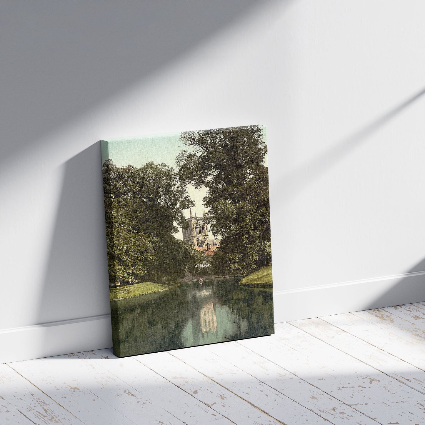 A picture of St. John's College, chapel from the river, Cambridge, England, a mockup of the print leaning against a wall