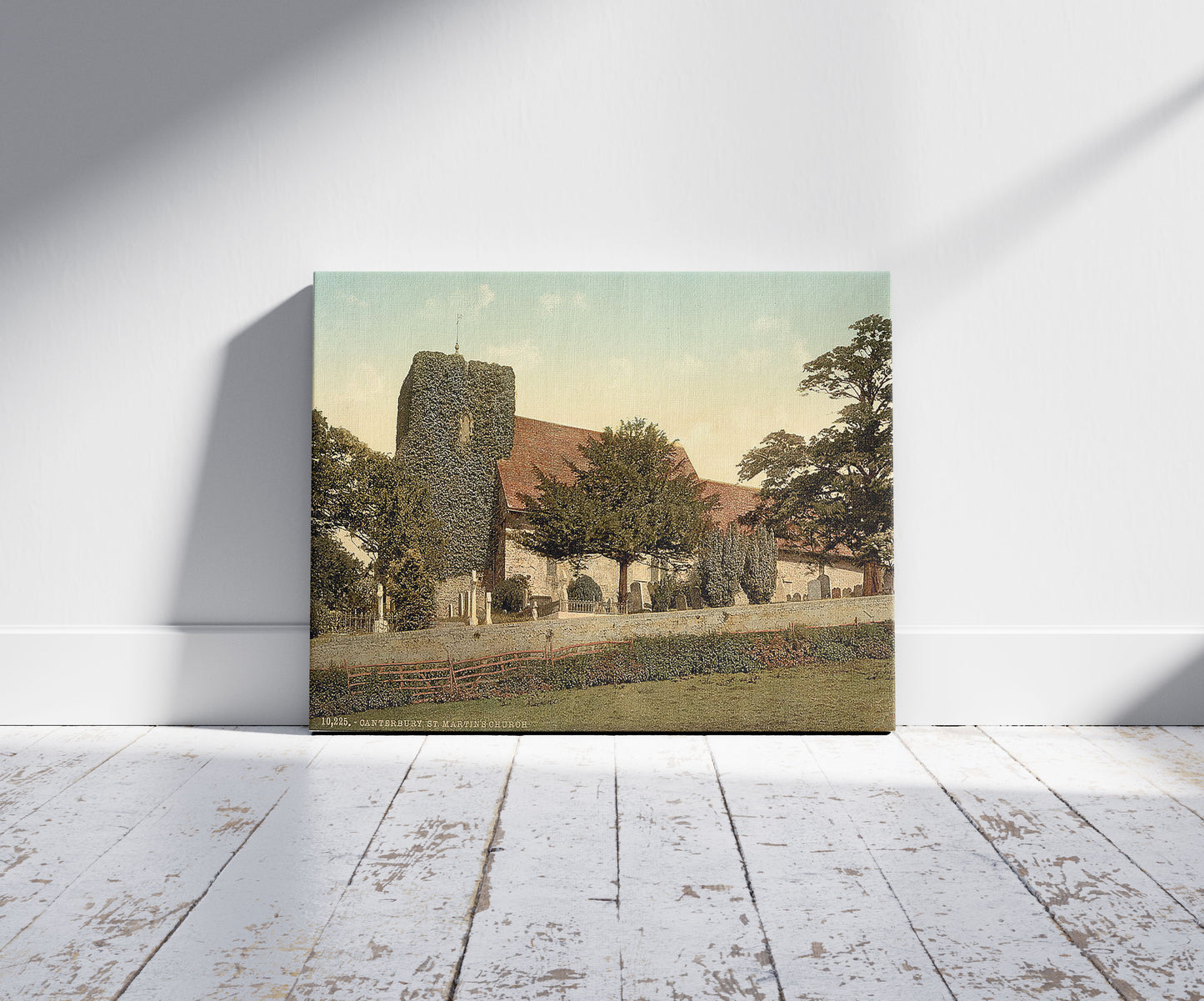 A picture of St. Martin's Church, Canterbury, England, a mockup of the print leaning against a wall