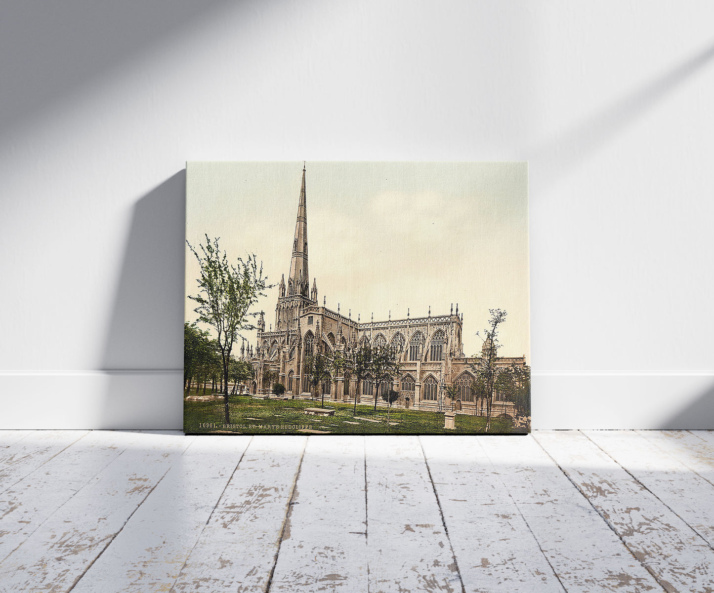 A picture of St. Mary Redcliffe, Bristol, England, a mockup of the print leaning against a wall