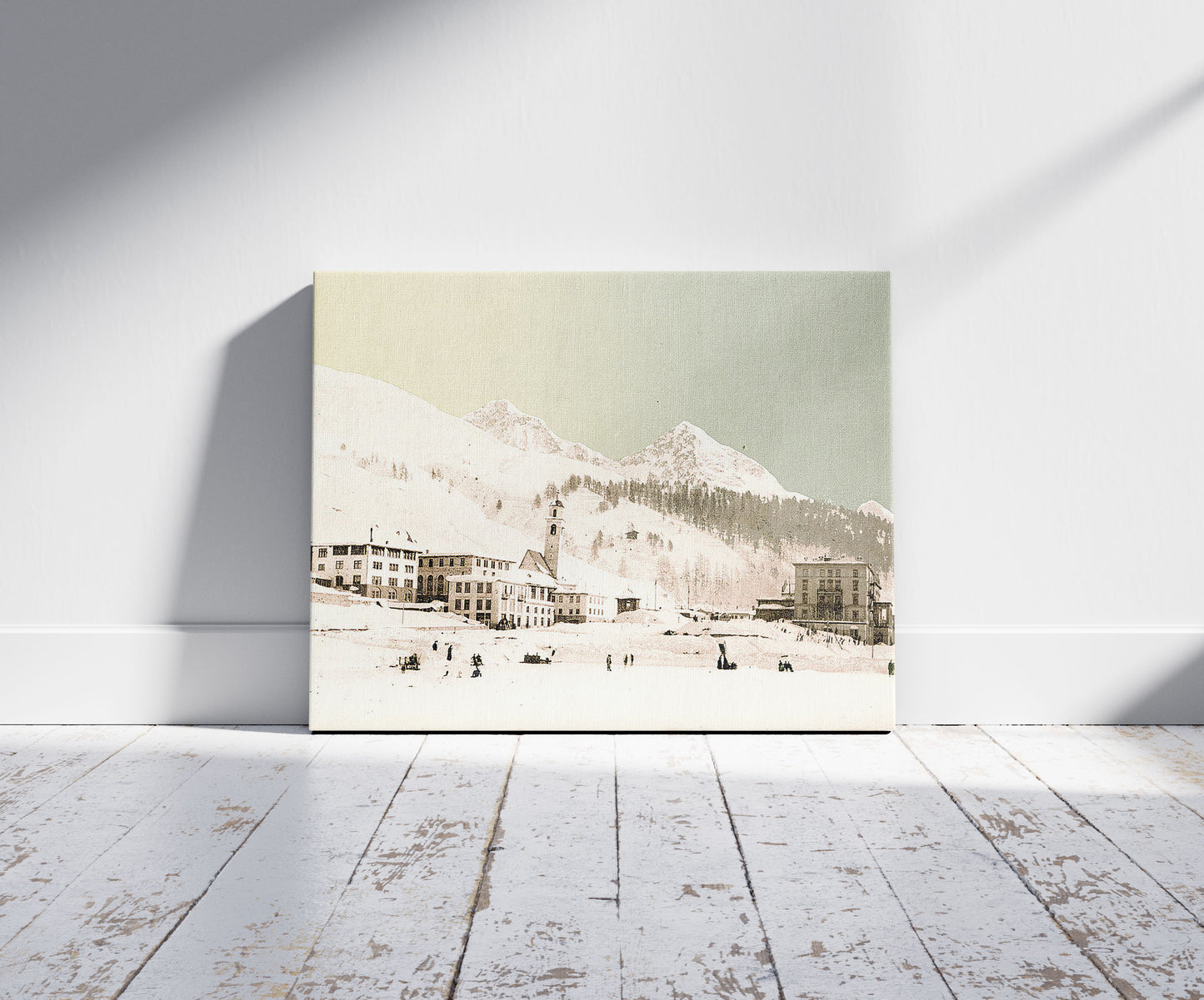 A picture of St. Moritz, Grisons, Switzerland, in winter (reversed), a mockup of the print leaning against a wall