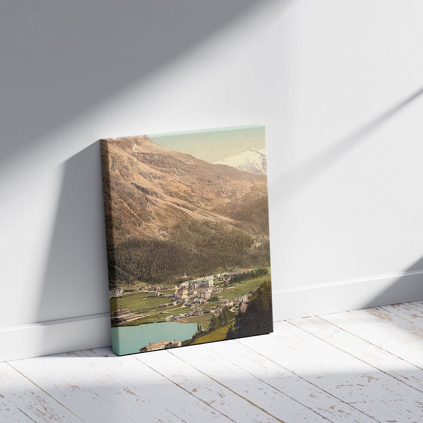 A picture of St. Moritz, village and baths, with Piz Surlej, Grisons, Switzerland, a mockup of the print leaning against a wall