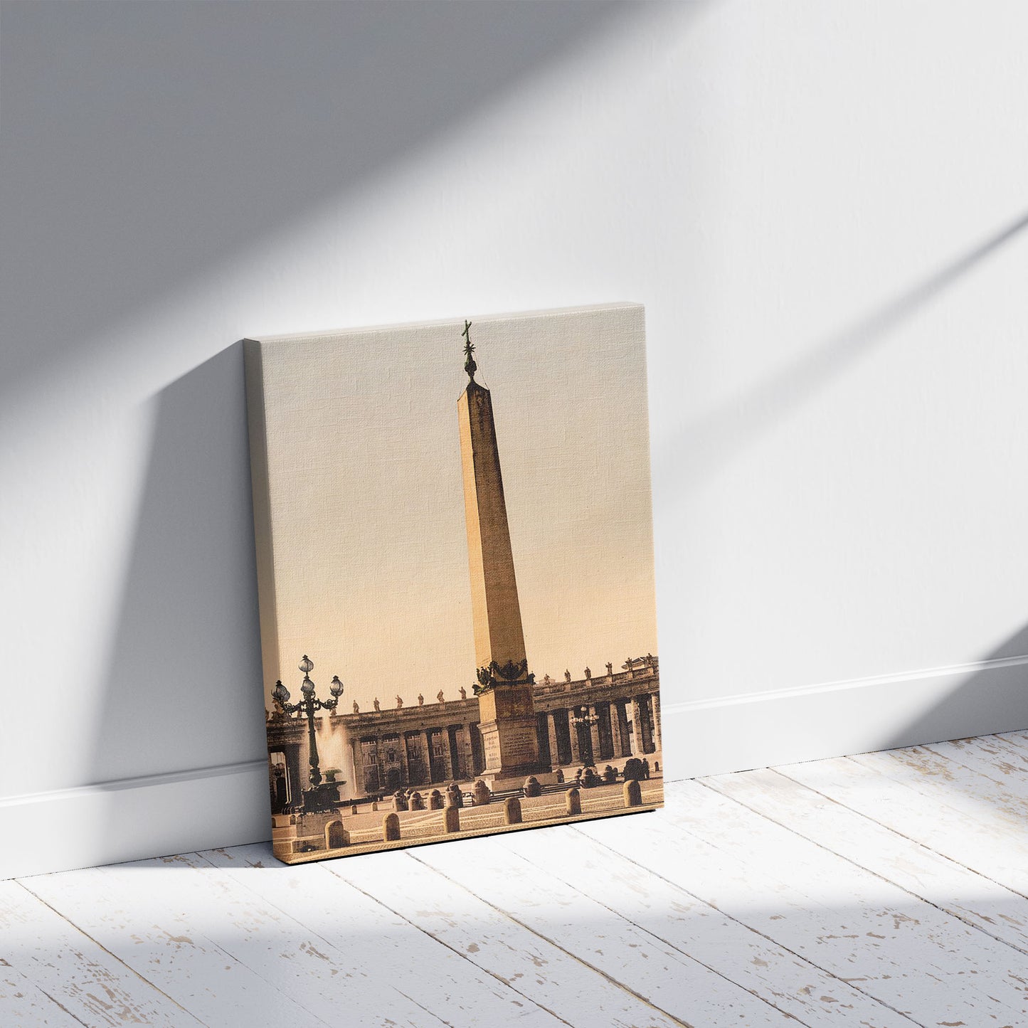 A picture of St. Peter's Place, the obelisk, Rome, Italy, a mockup of the print leaning against a wall