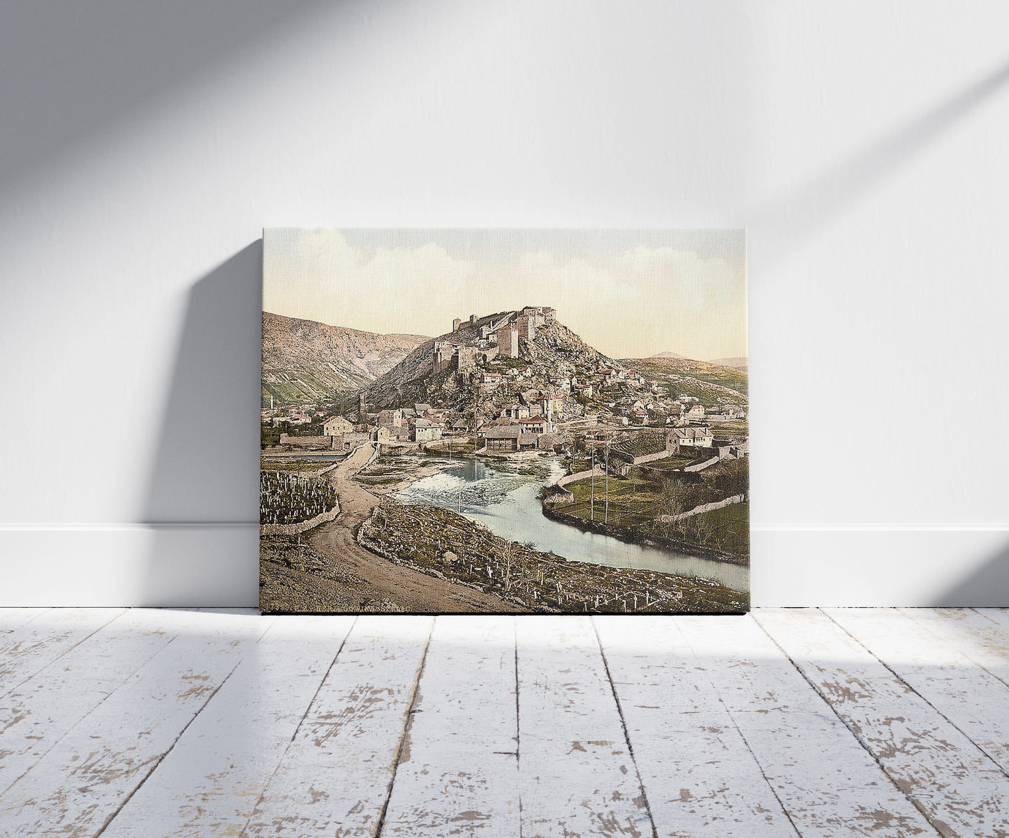 A picture of Stolac, Herzegovina, Austro-Hungary, a mockup of the print leaning against a wall
