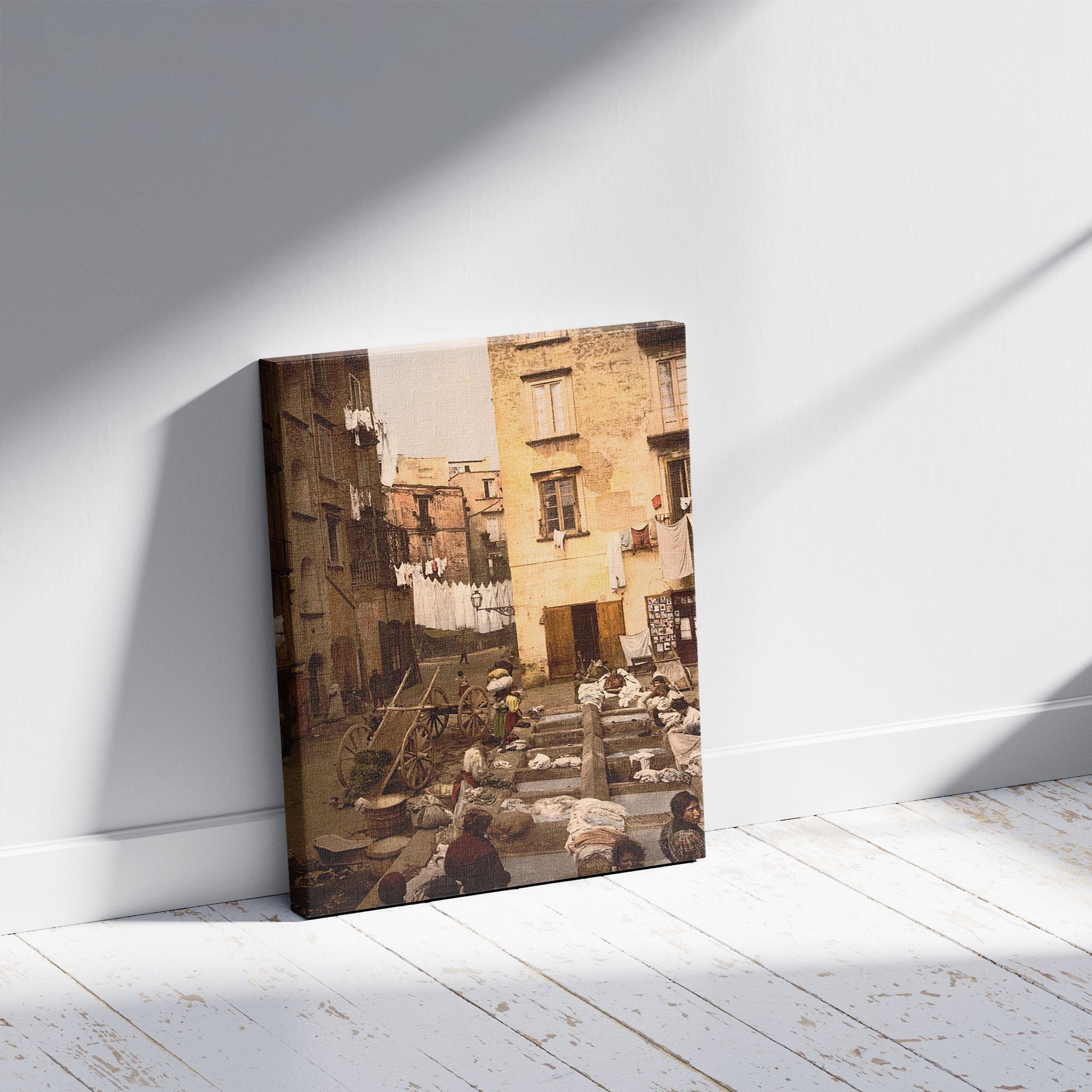 A picture of Street with washerwomen, Naples, Italy, a mockup of the print leaning against a wall