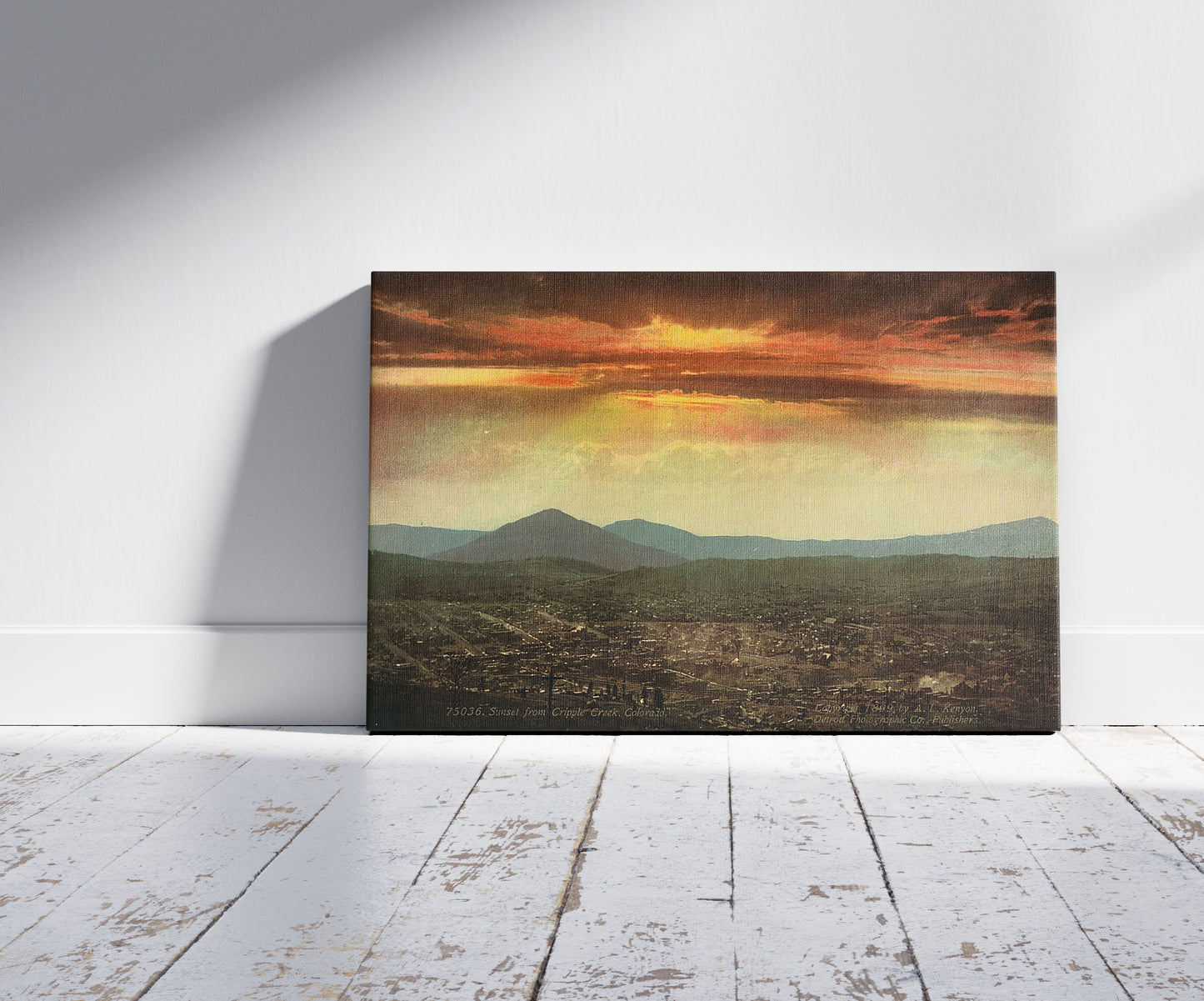 A picture of Sunset from Cripple Creek, Colorado, a mockup of the print leaning against a wall