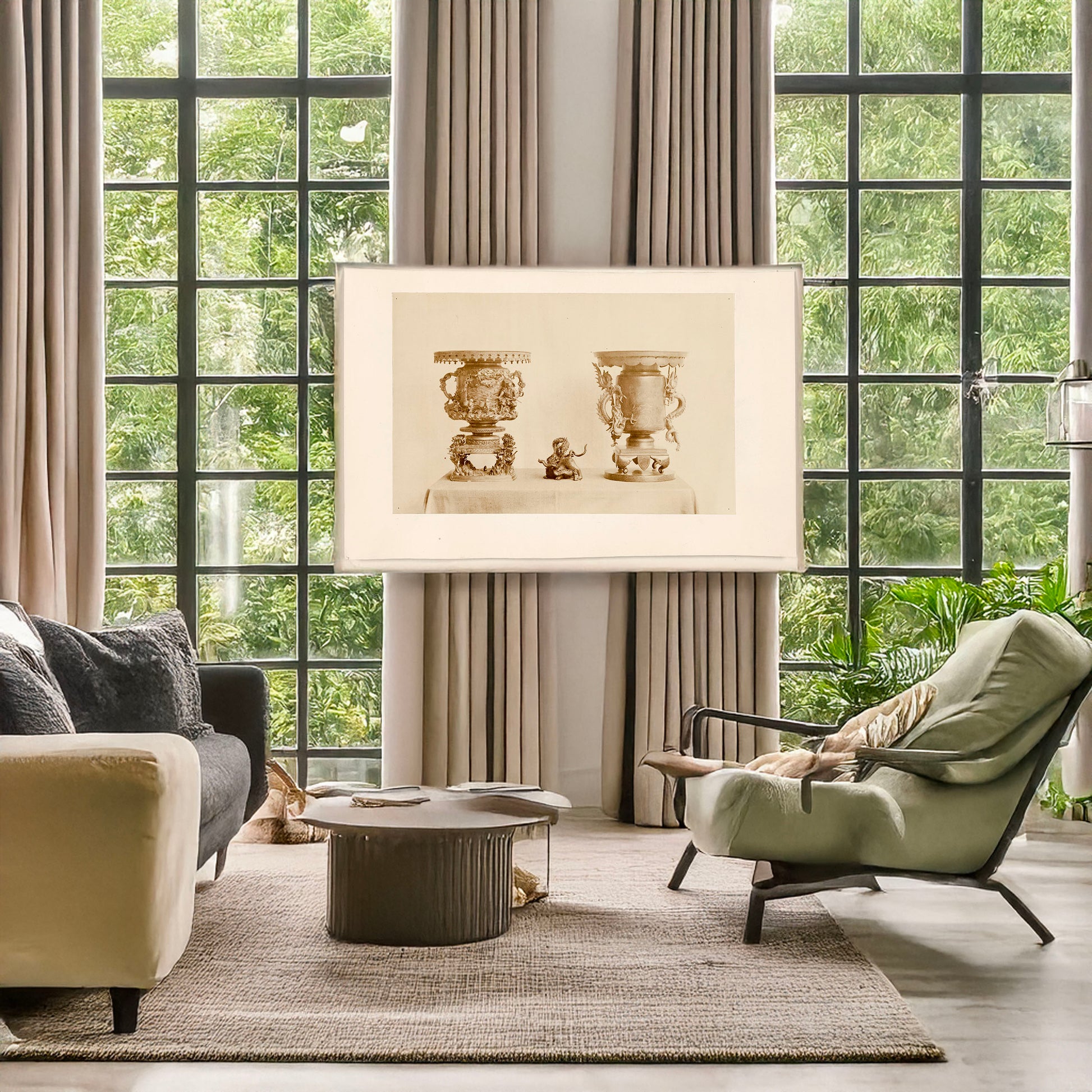 A picture of Tall, metal, ornate plant stands and figurine, all with dragon motif, on a table, a mockup of the print leaning against a wall