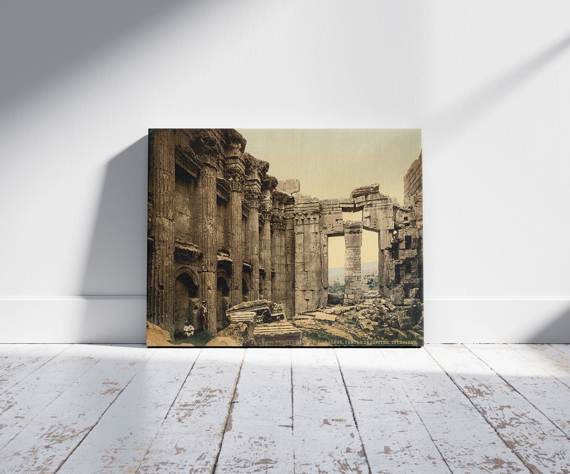 A picture of Temple of Jupiter, interior, Baalbek, Holy Land, (i.e., Ba'labakk, Lebanon), a mockup of the print leaning against a wall