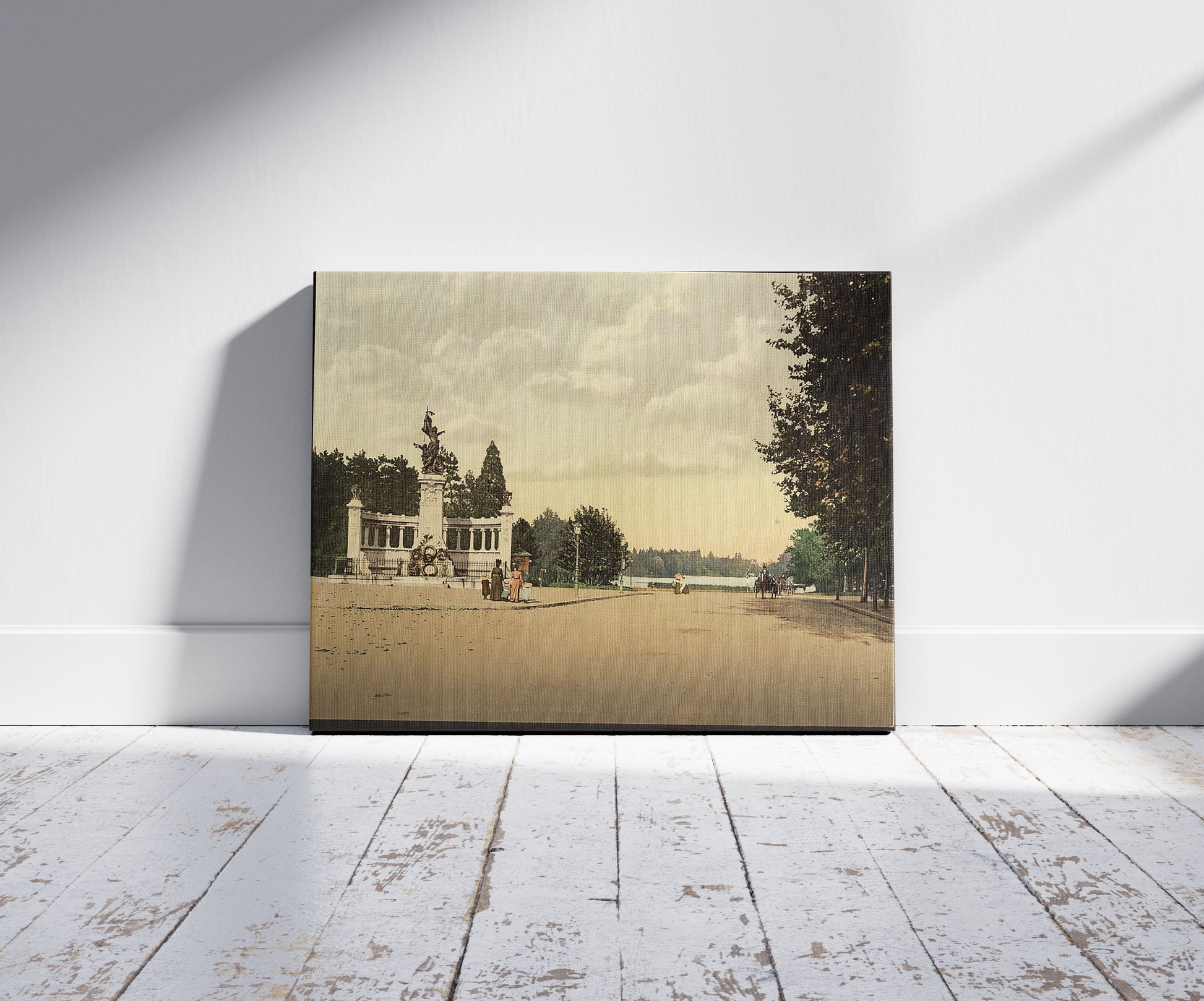 A picture of Tête d'Or park and monument to the Legions of the Rhone, Lyons, France, a mockup of the print leaning against a wall