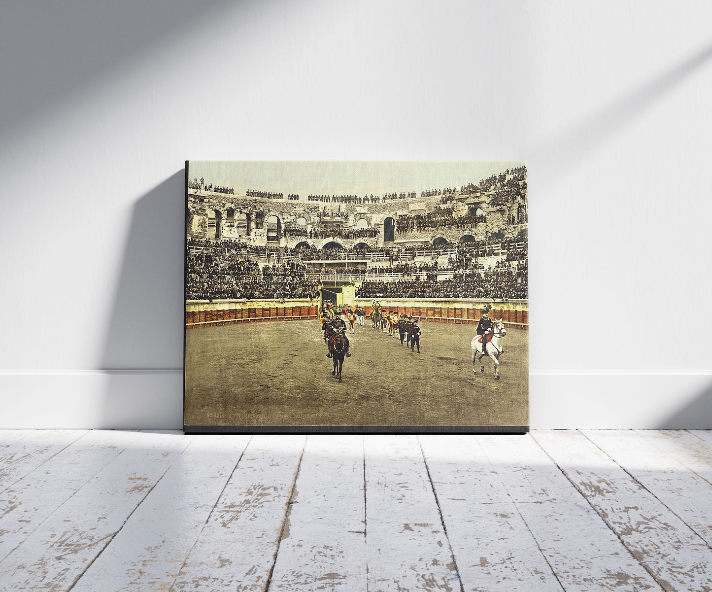 A picture of The arena, bull ring, Nîmes, France, a mockup of the print leaning against a wall