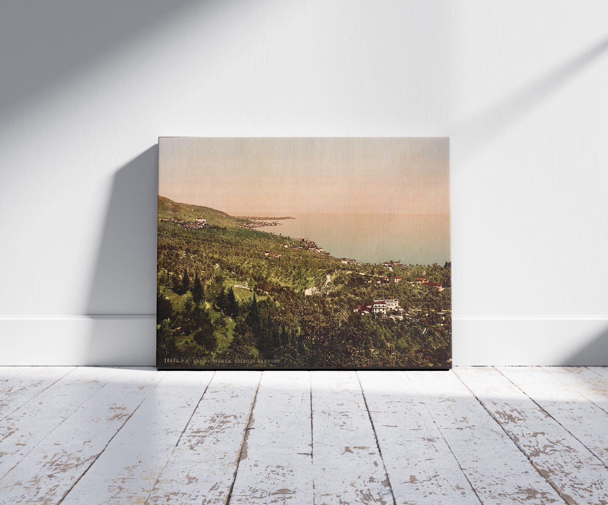 A picture of The bay, Gardone, Lake Garda, Italy, a mockup of the print leaning against a wall