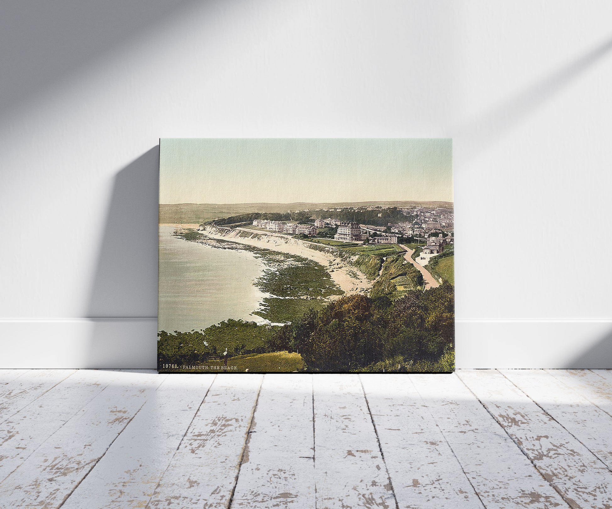 A picture of The beach, Falmouth, Cornwall, England, a mockup of the print leaning against a wall