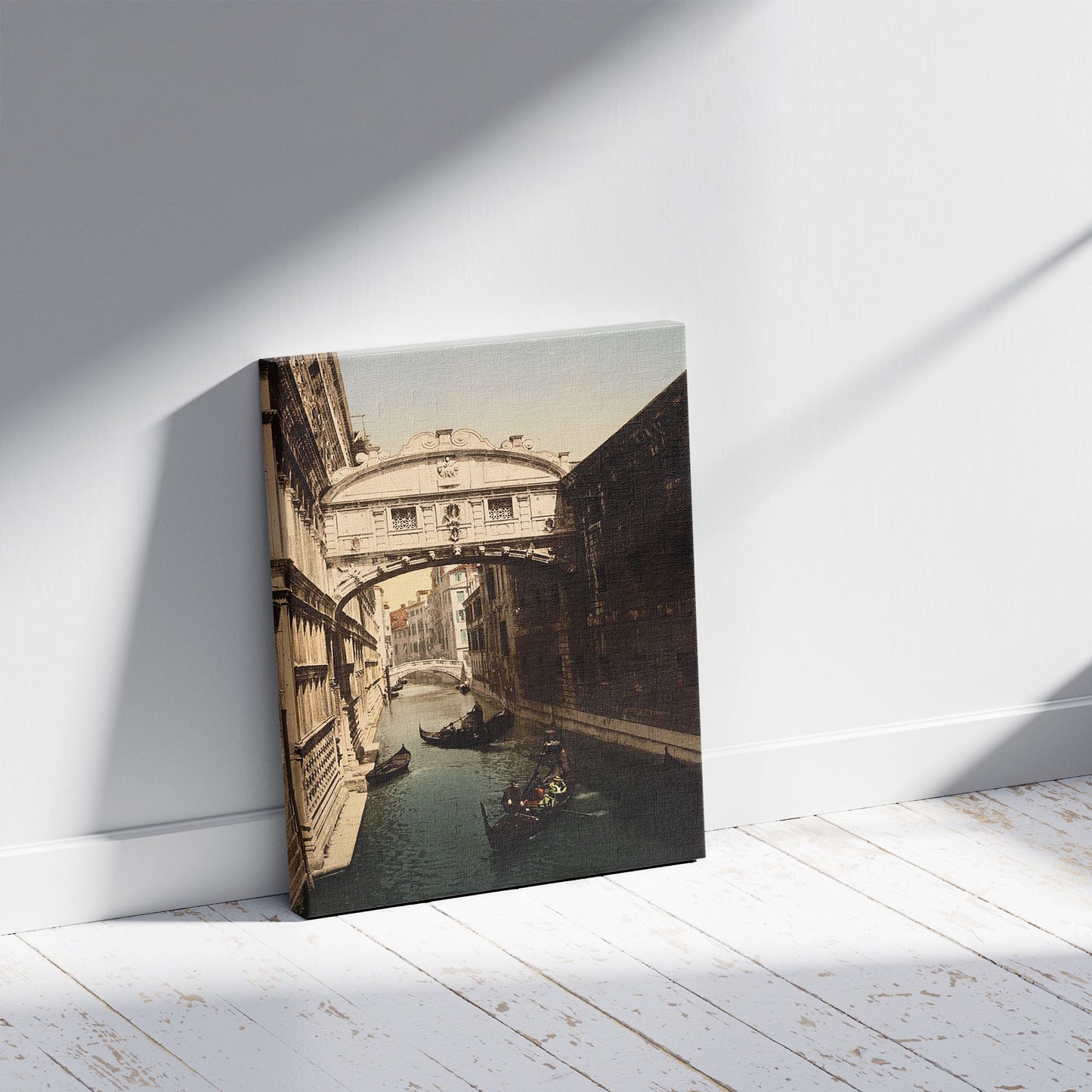 A picture of The Bridge of Sighs, Venice, Italy, a mockup of the print leaning against a wall