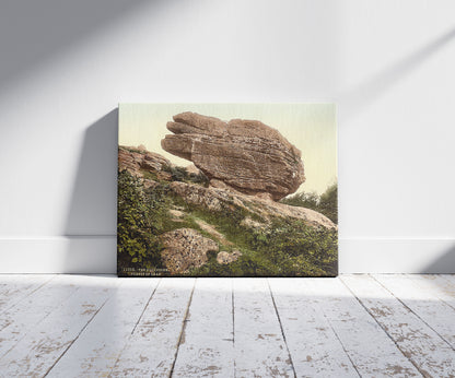 A picture of The Buckstone, Forest of Dean, England, a mockup of the print leaning against a wall