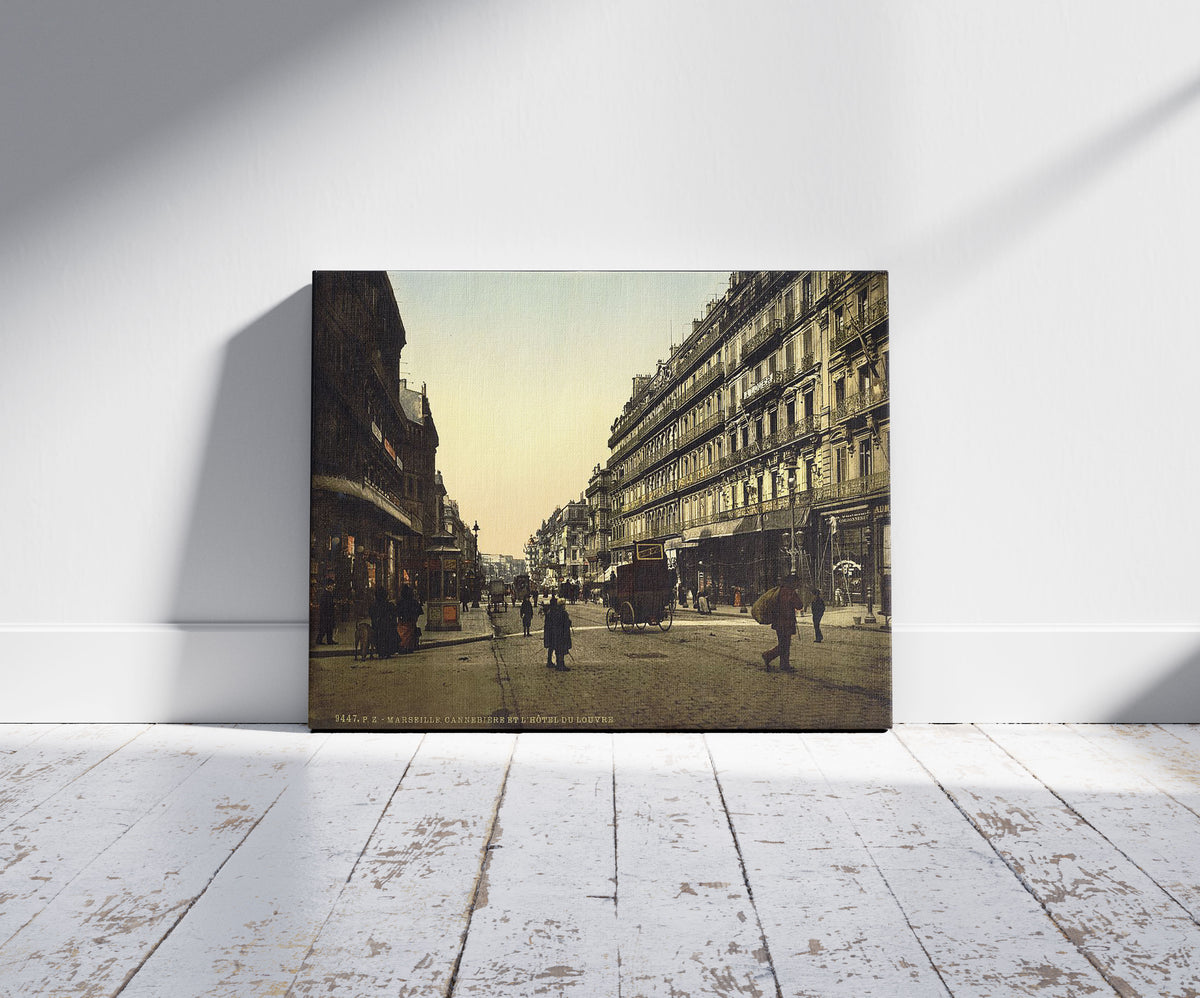 A picture of The Cannabiere (i.e., Cannebière) and Hotel de Louvre, Marseilles, France, a mockup of the print leaning against a wall