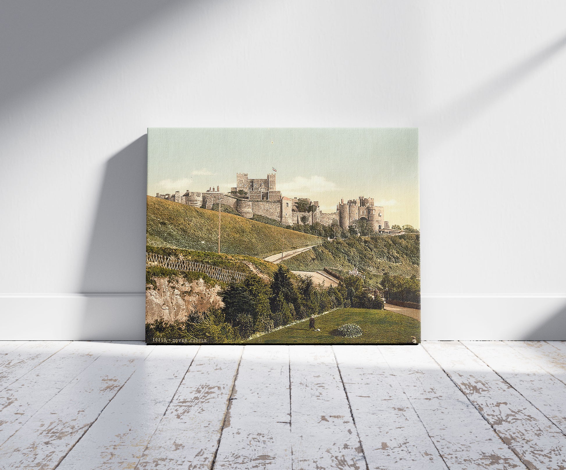 A picture of The castle, Dover, England, a mockup of the print leaning against a wall