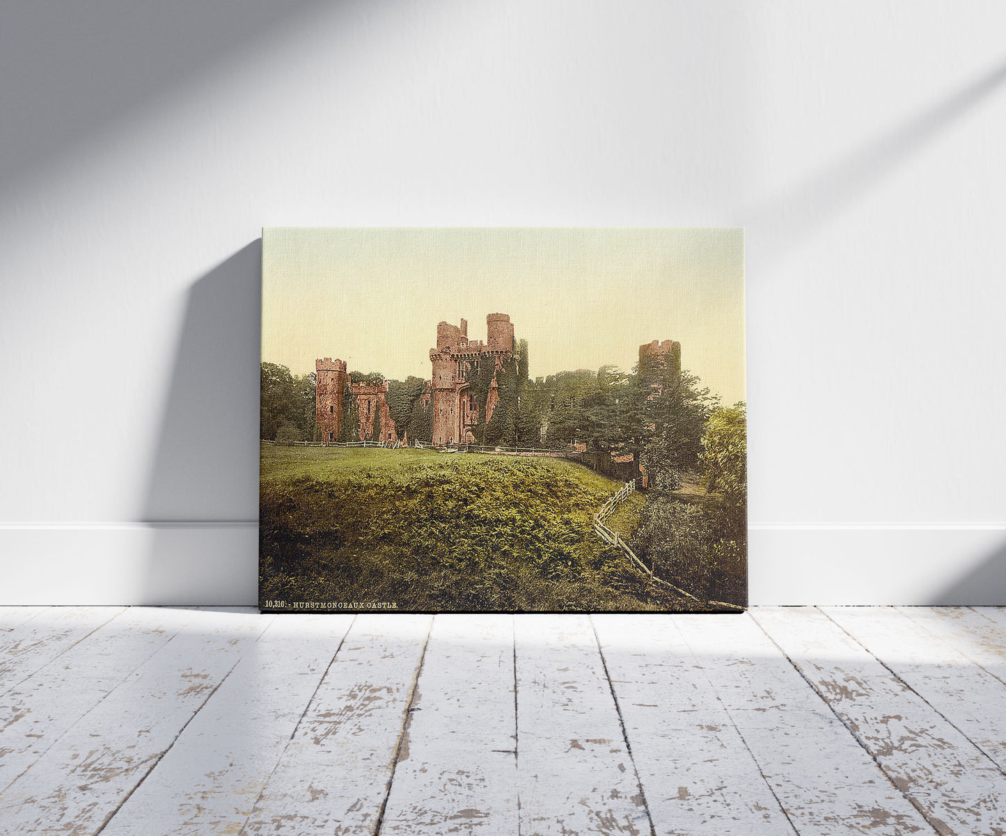 A picture of The castle, Hurstmonceux, England, a mockup of the print leaning against a wall