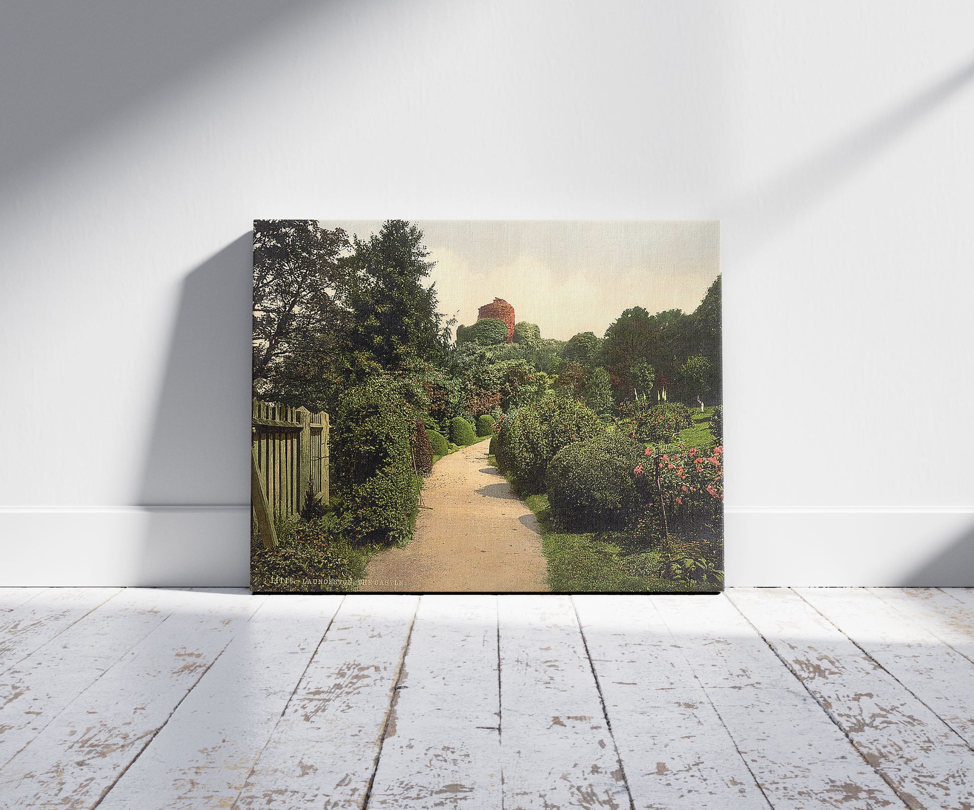 A picture of The castle, Launceston, Cornwall, England, a mockup of the print leaning against a wall