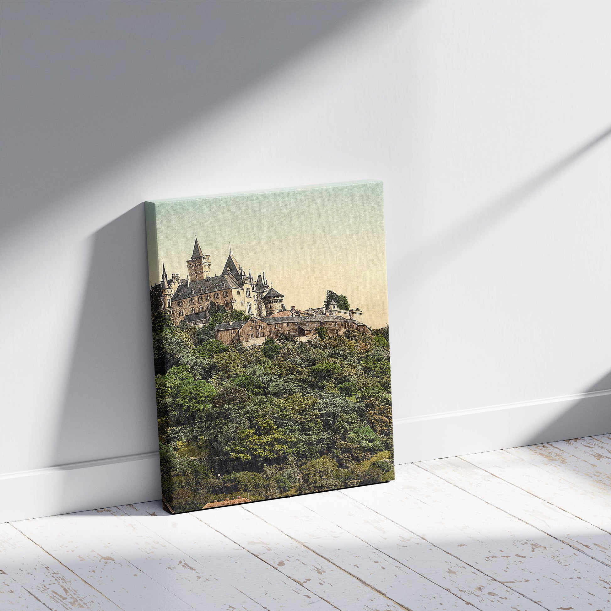 A picture of The castle, Wernigerode, Hartz, Germany, a mockup of the print leaning against a wall