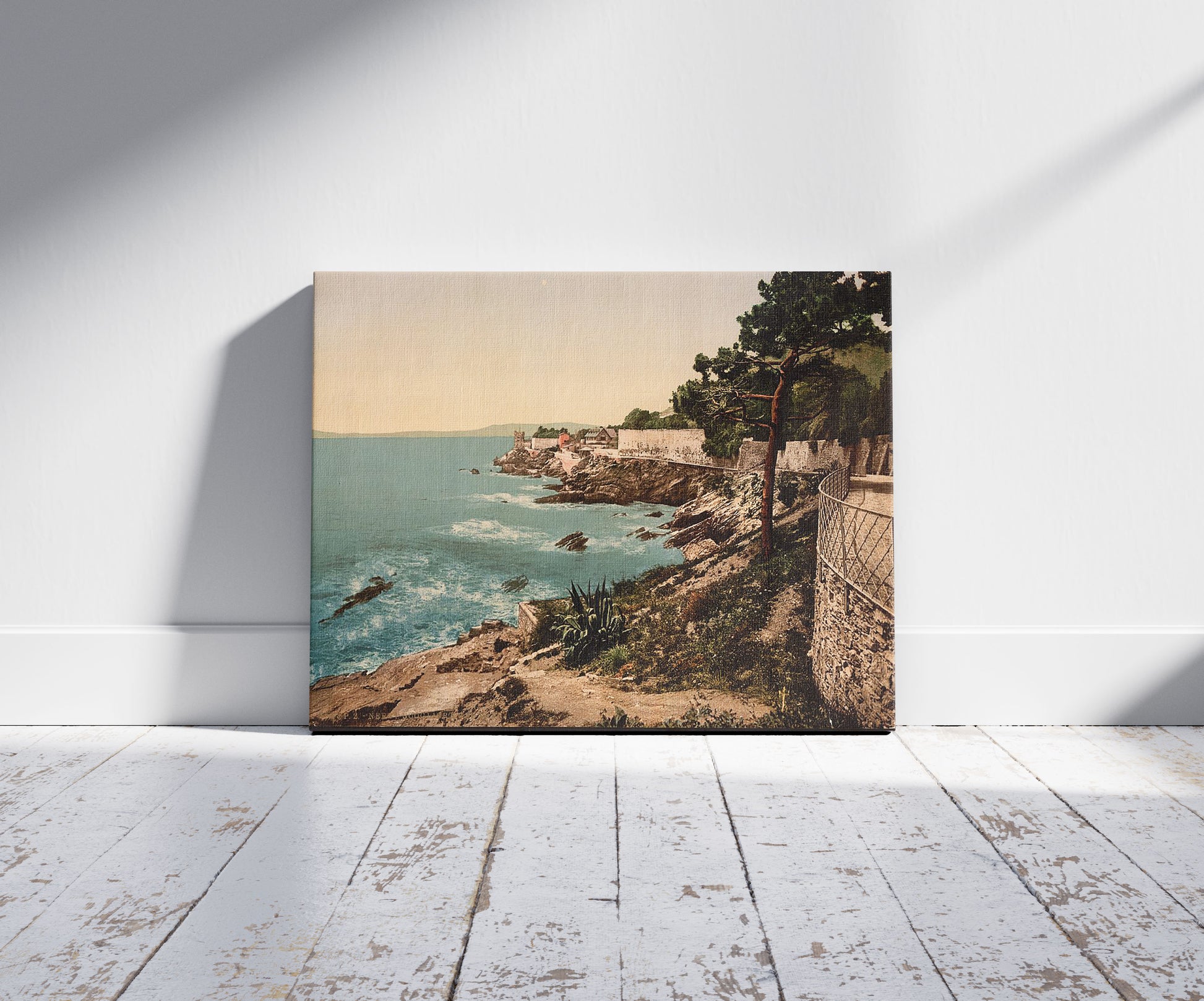 A picture of The cliffs, Nervi, Genoa, Italy, a mockup of the print leaning against a wall