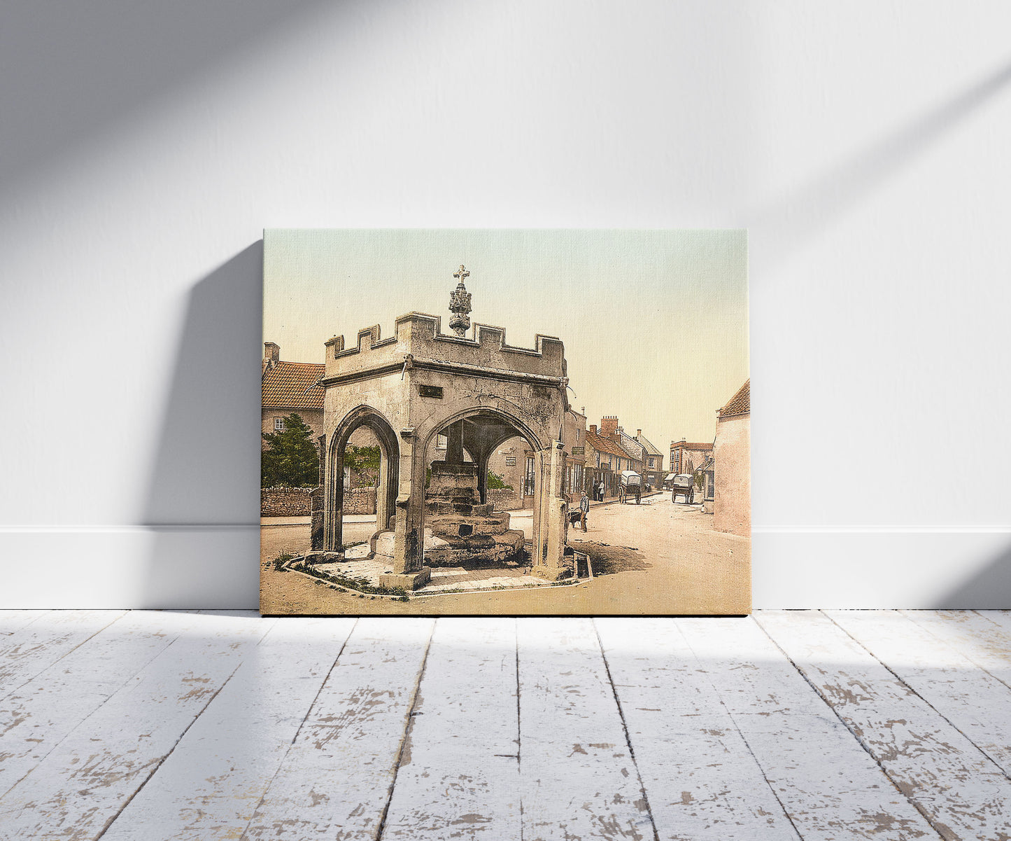 A picture of The Cross, Cheddar, England, a mockup of the print leaning against a wall