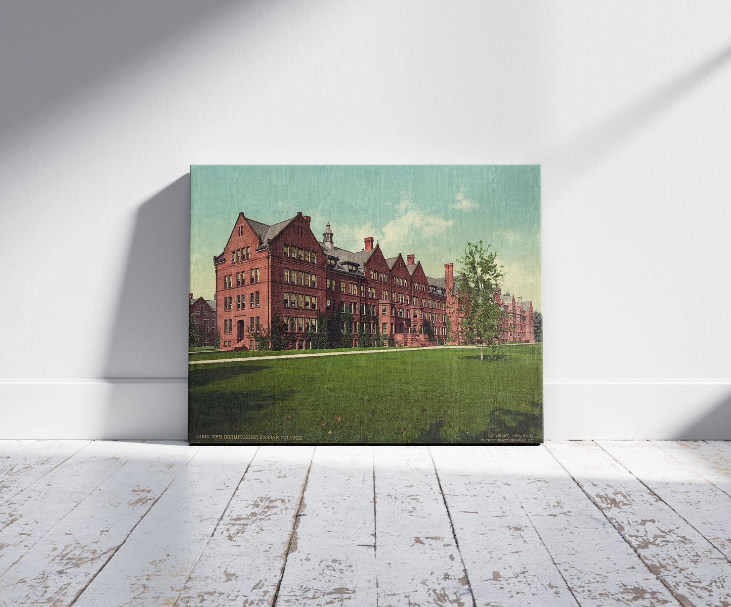 A picture of The dormitories, Vassar College, a mockup of the print leaning against a wall