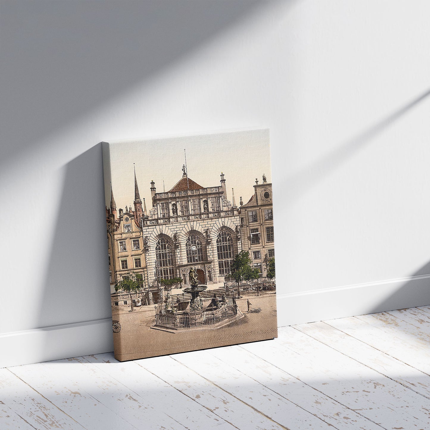 A picture of The Exchange and Artushof, Danzig, West Prussia, Germany (i.e., Gdańsk, Poland), a mockup of the print leaning against a wall