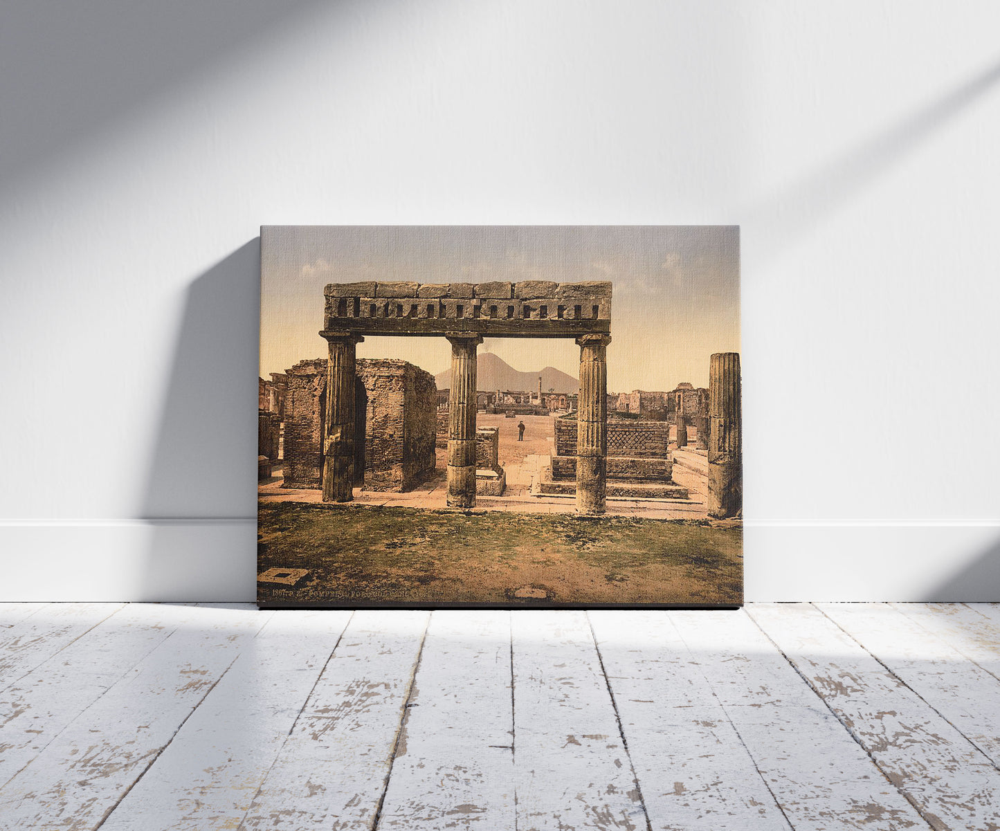 A picture of The Forum, Pompeii, Italy, a mockup of the print leaning against a wall