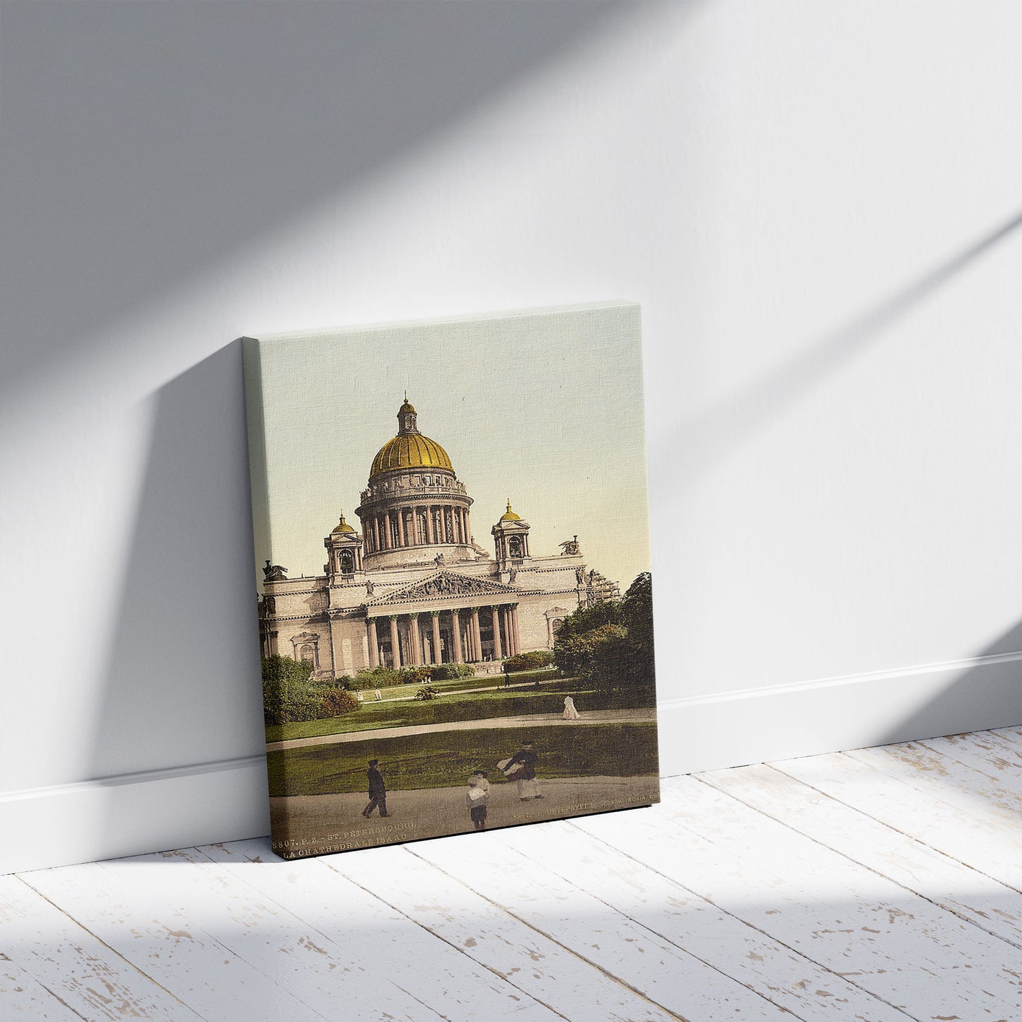 A picture of The Isaac Cathedral from Alexander's Garden, St. Petersburg, Russia, a mockup of the print leaning against a wall