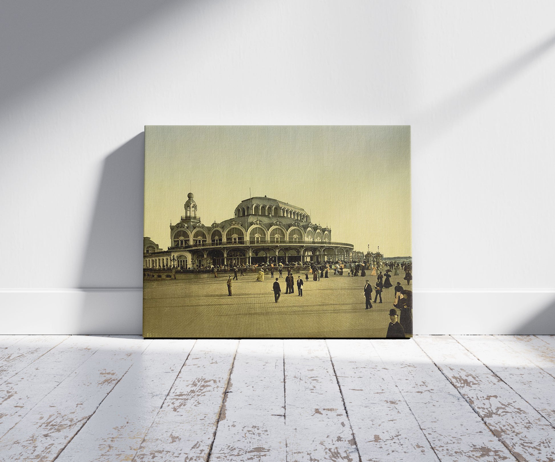 A picture of The Kursaal, (i.e., Cursaal), Ostend, Belgium, a mockup of the print leaning against a wall