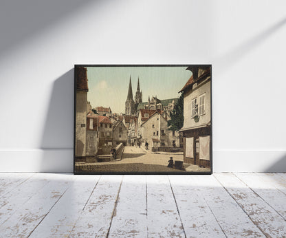 A picture of The market street, Chartres, France, a mockup of the print leaning against a wall