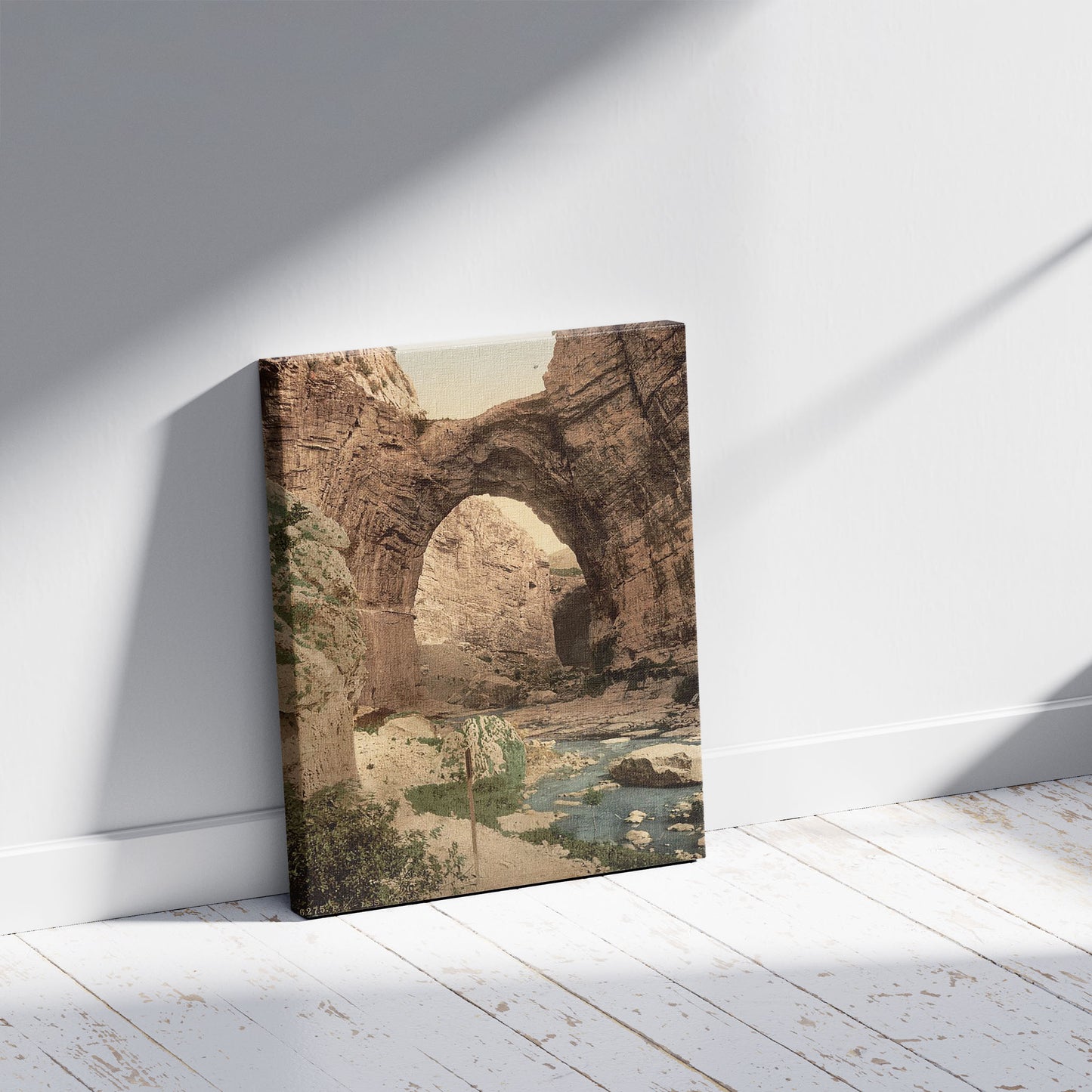 A picture of The natural arch, Constantine, Algeria, a mockup of the print leaning against a wall