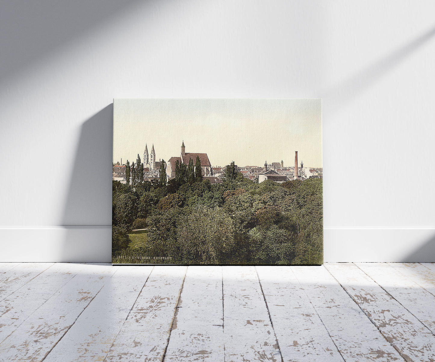 A picture of The new city, Vienna, Austro-Hungary, a mockup of the print leaning against a wall