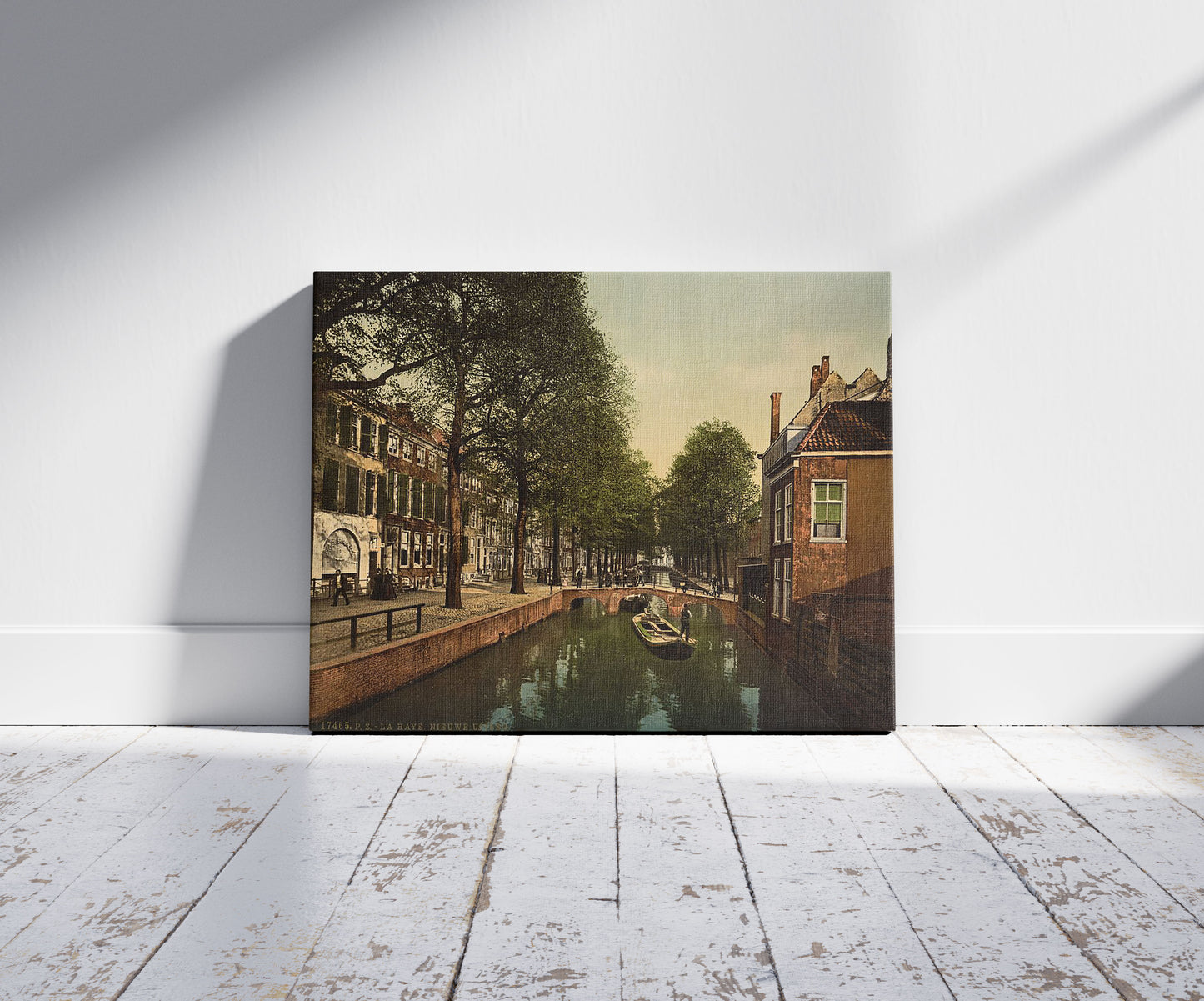 A picture of The New Uitleg (canal), Hague, Holland, a mockup of the print leaning against a wall