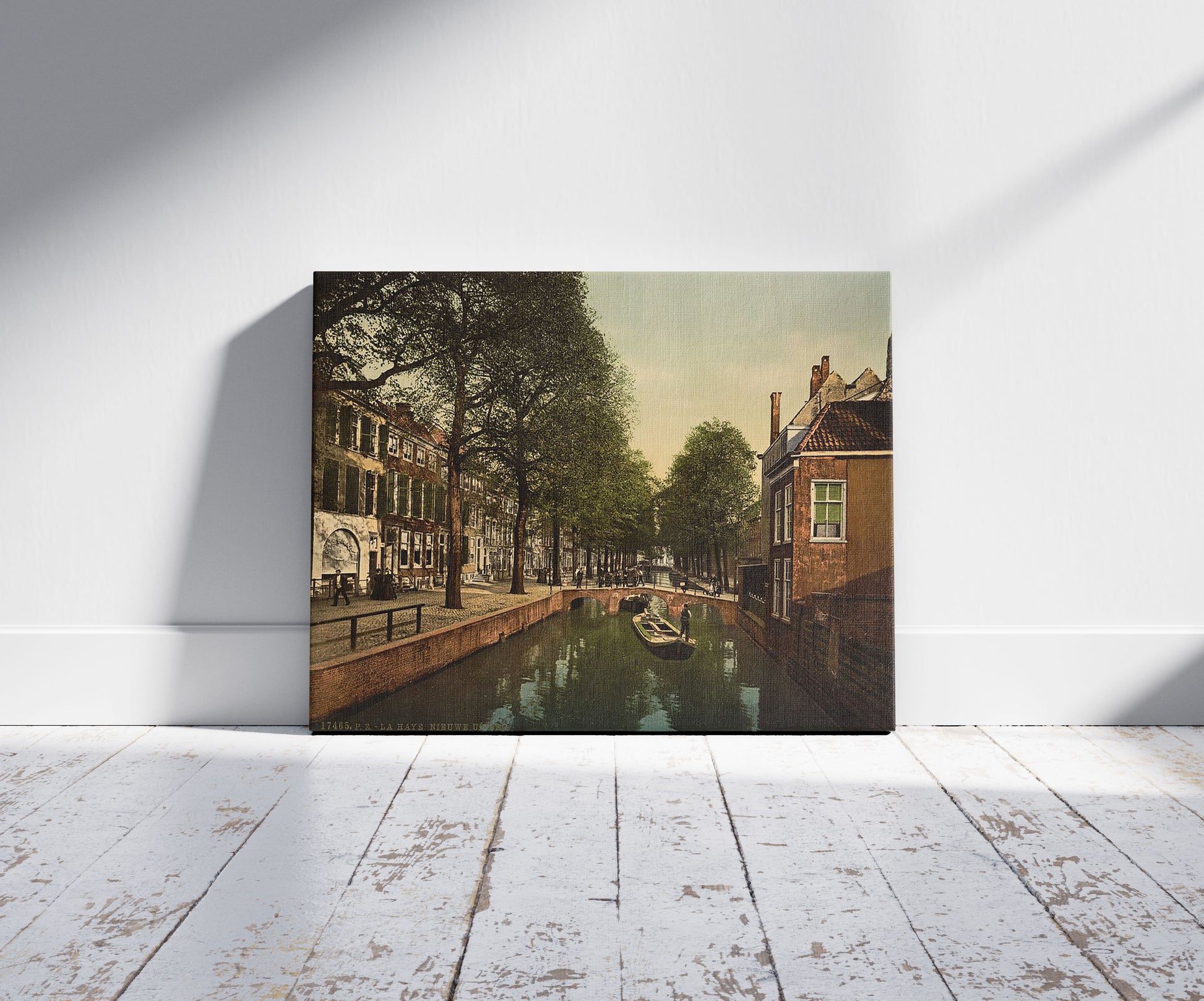 A picture of The New Uitleg (canal), Hague, Holland, a mockup of the print leaning against a wall