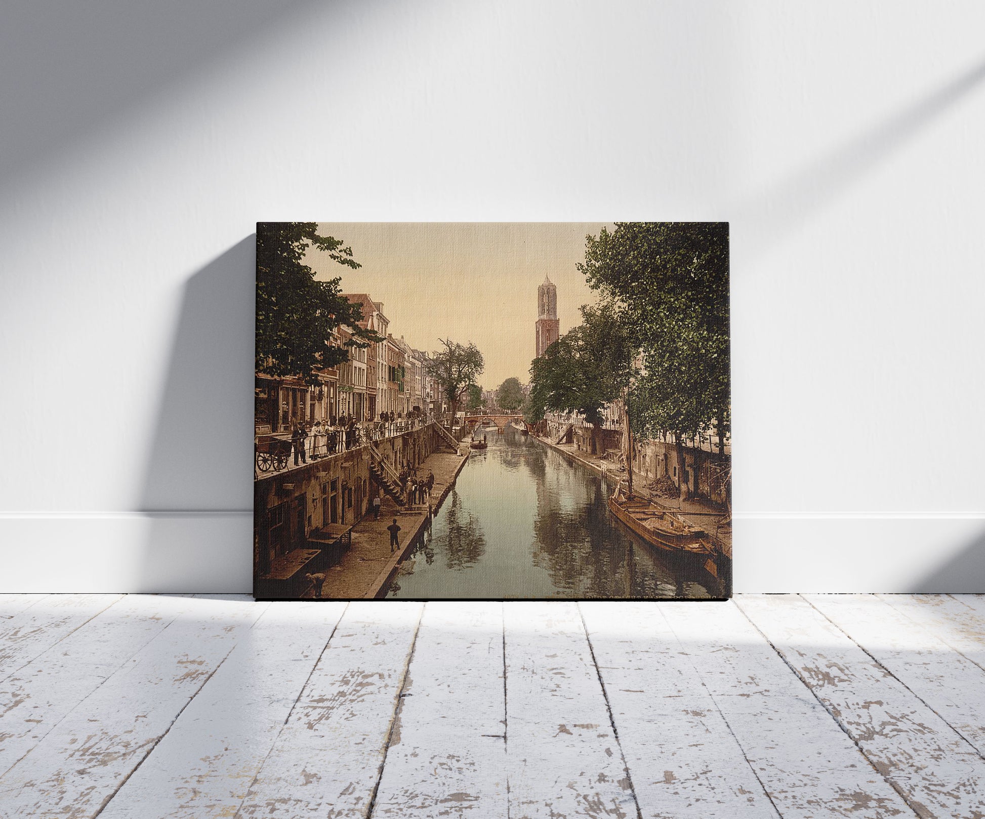A picture of The Oude Gracht Hamburgerbrug, Utrecht, Holland, a mockup of the print leaning against a wall
