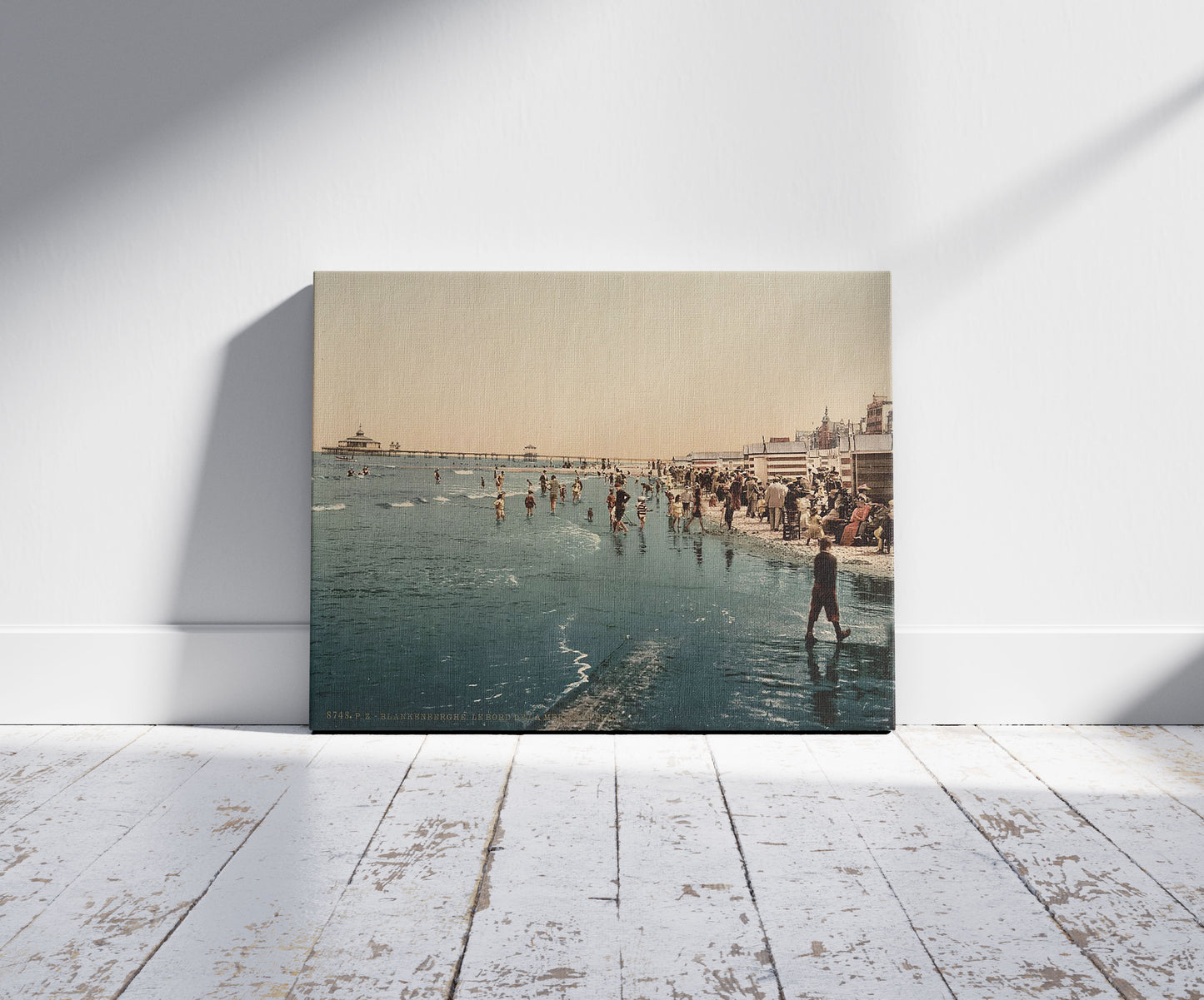 A picture of The pier and shore, Blankenberghe, Belgium, a mockup of the print leaning against a wall