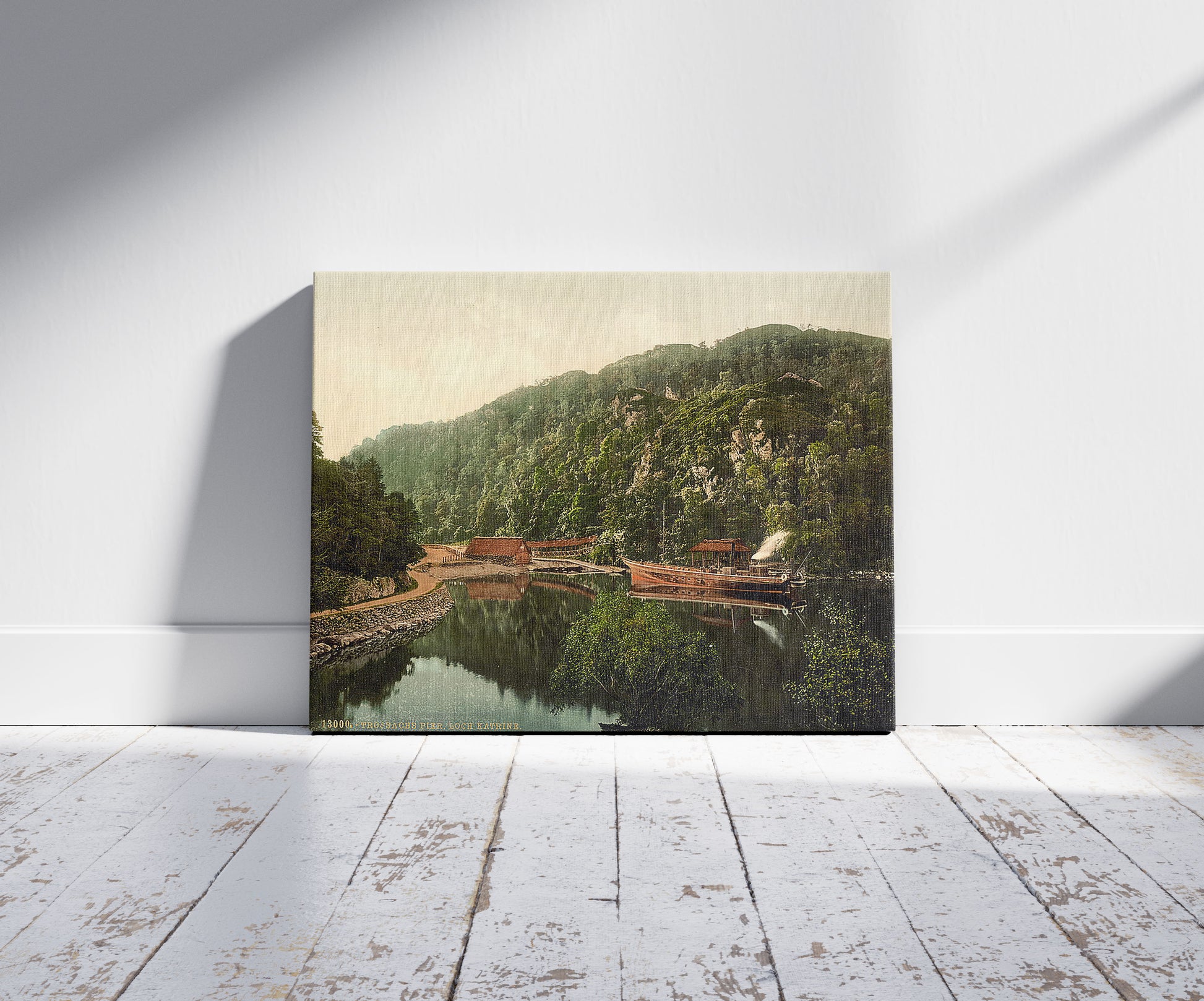 A picture of The pier, Loch Katrine, Trossachs, Scotland, a mockup of the print leaning against a wall