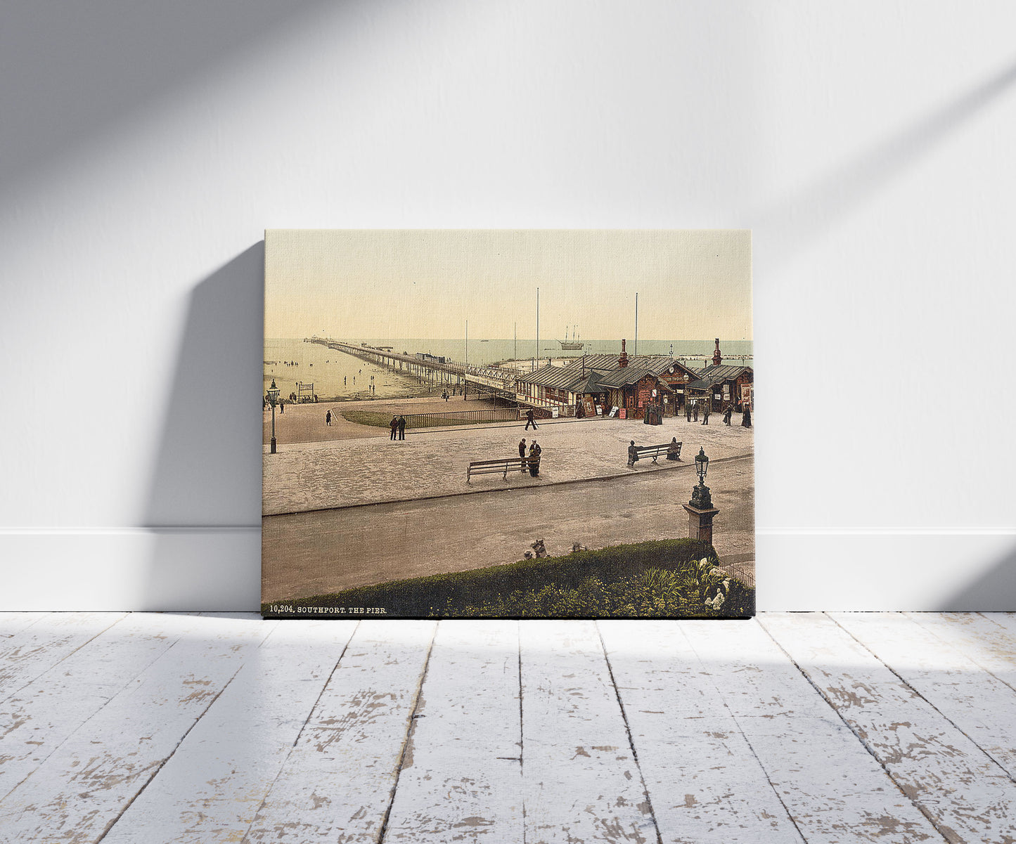 A picture of The pier, Southport, England, a mockup of the print leaning against a wall