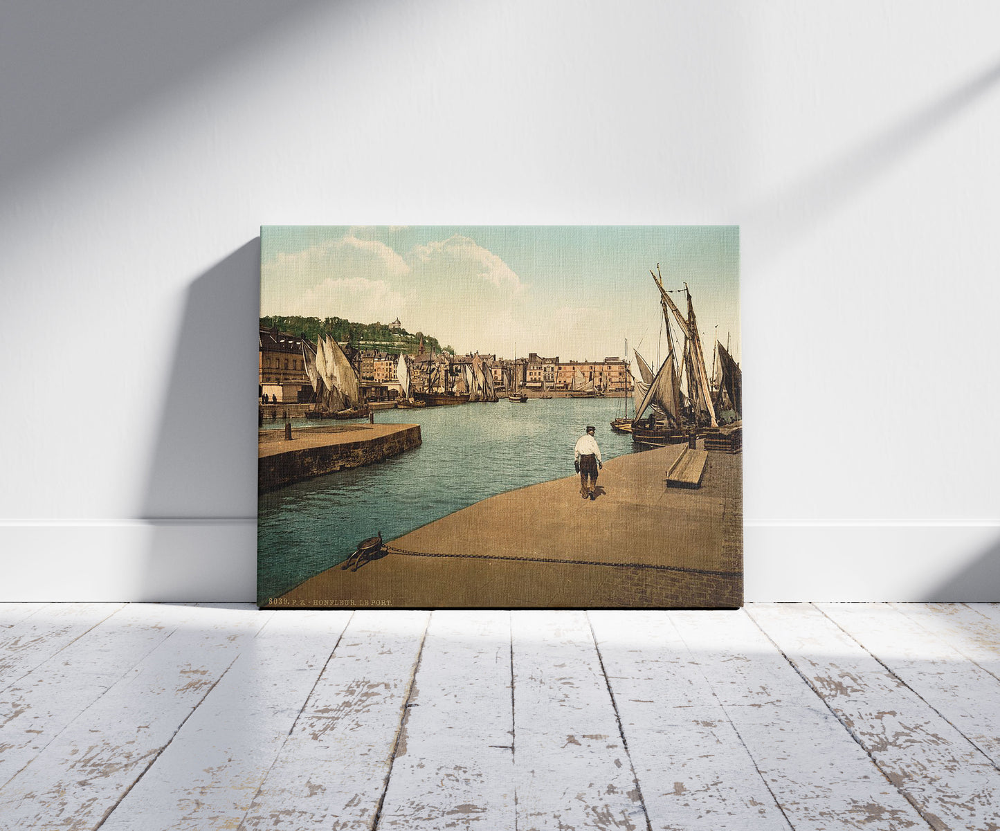 A picture of The port, Honfleur, France, a mockup of the print leaning against a wall