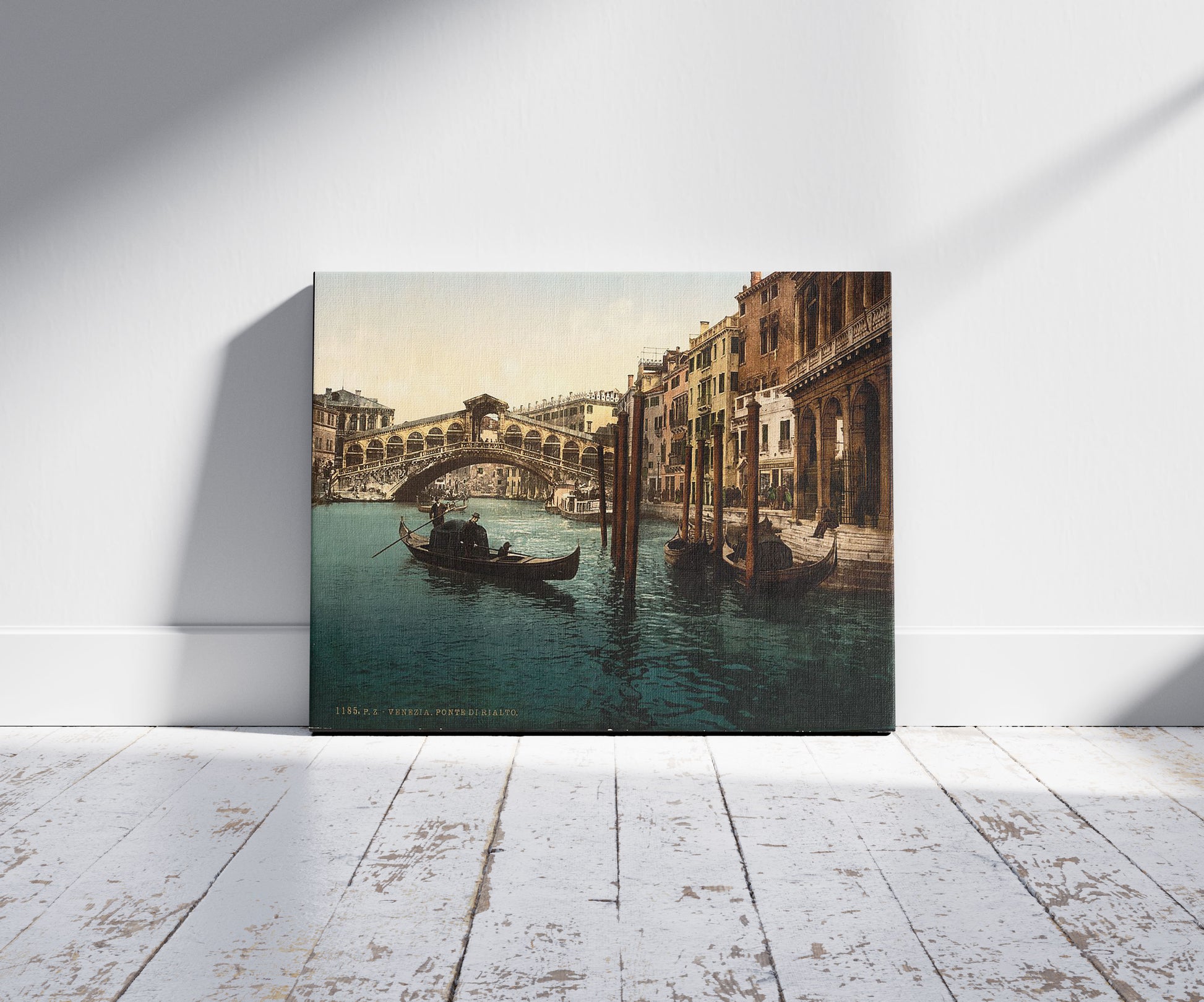 A picture of The Rialto Bridge, Venice, Italy, a mockup of the print leaning against a wall