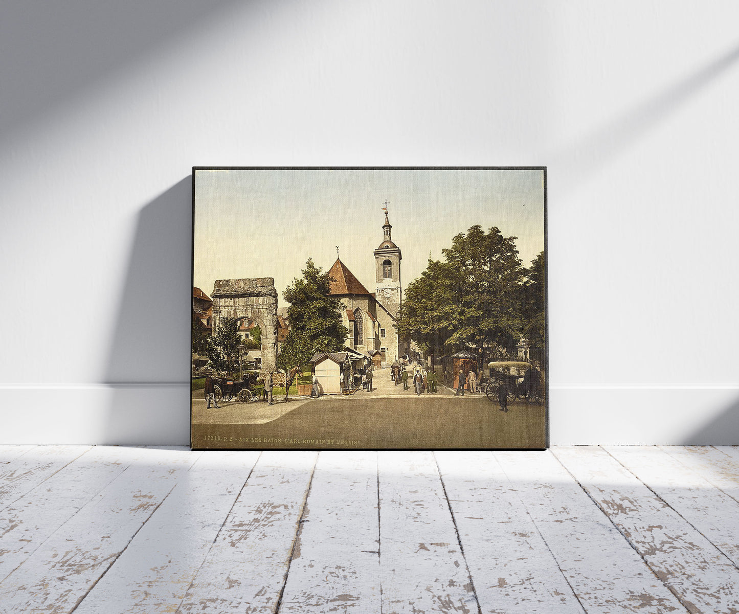 A picture of The roman arch and the church, Aix, France, a mockup of the print leaning against a wall