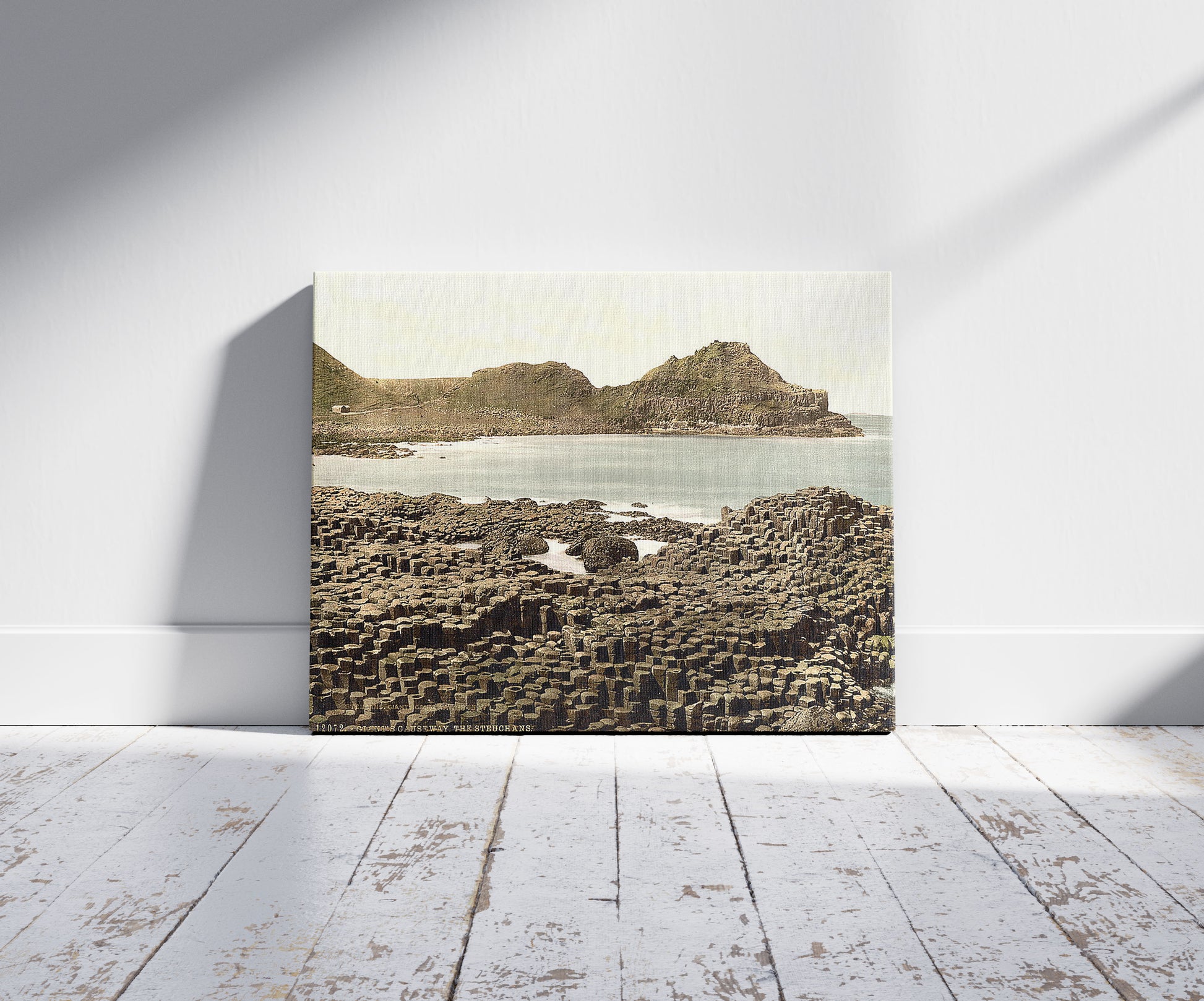 A picture of The Steuchans. Giant's Causeway. County Antrim, Ireland, a mockup of the print leaning against a wall