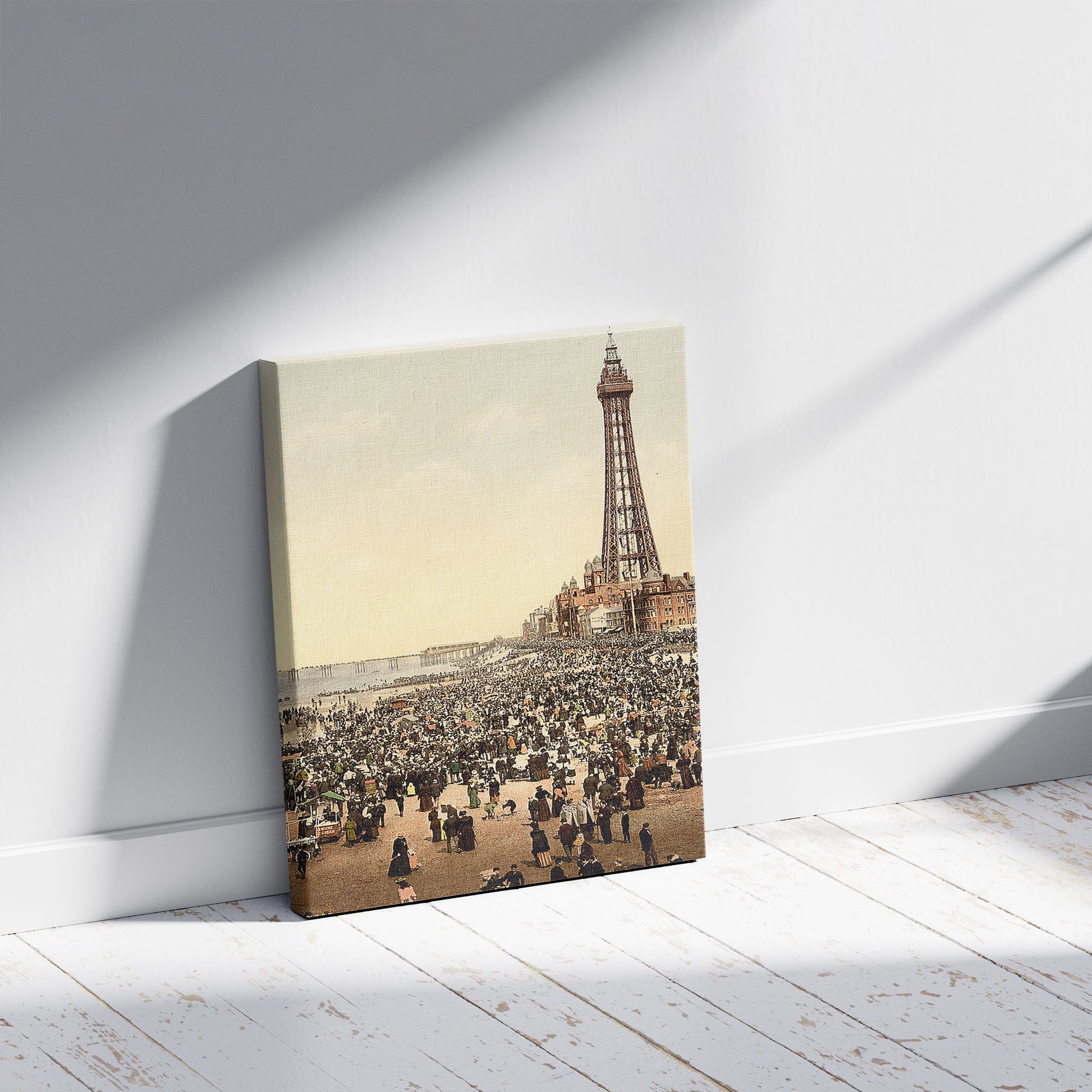 A picture of The tower with beach, Blackpool, England, a mockup of the print leaning against a wall