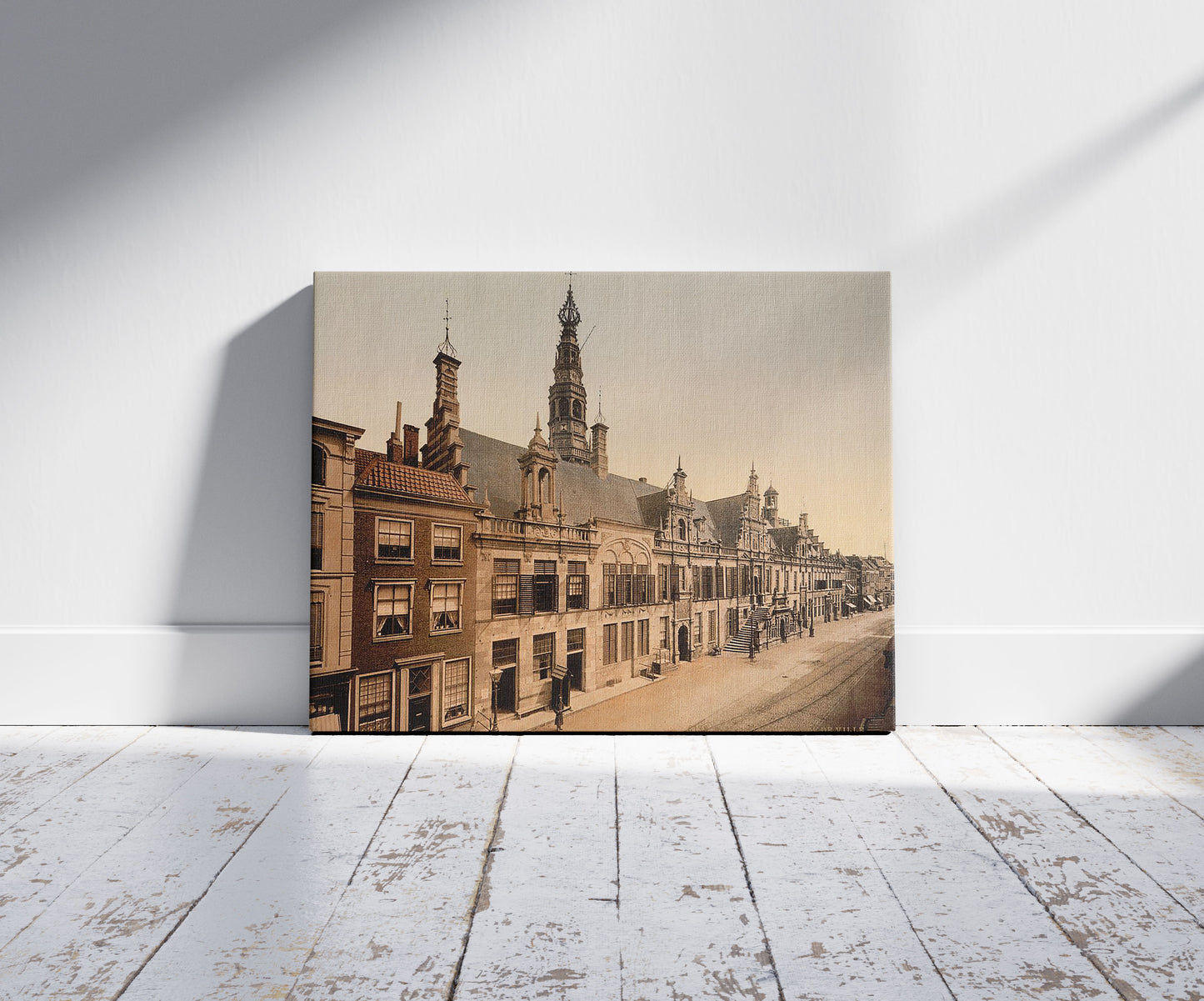 A picture of The town hall, Leyden, (i.e., Leiden) Holland, a mockup of the print leaning against a wall