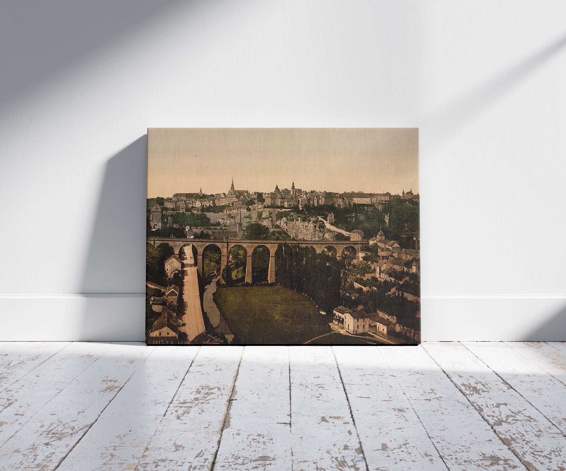 A picture of The town, Luxembourg, a mockup of the print leaning against a wall