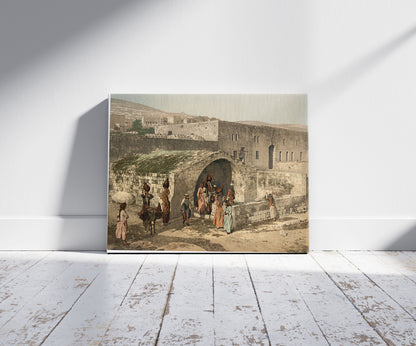 A picture of The virgin's fountain, Nazareth, Holy Land, (i.e. Israel), a mockup of the print leaning against a wall