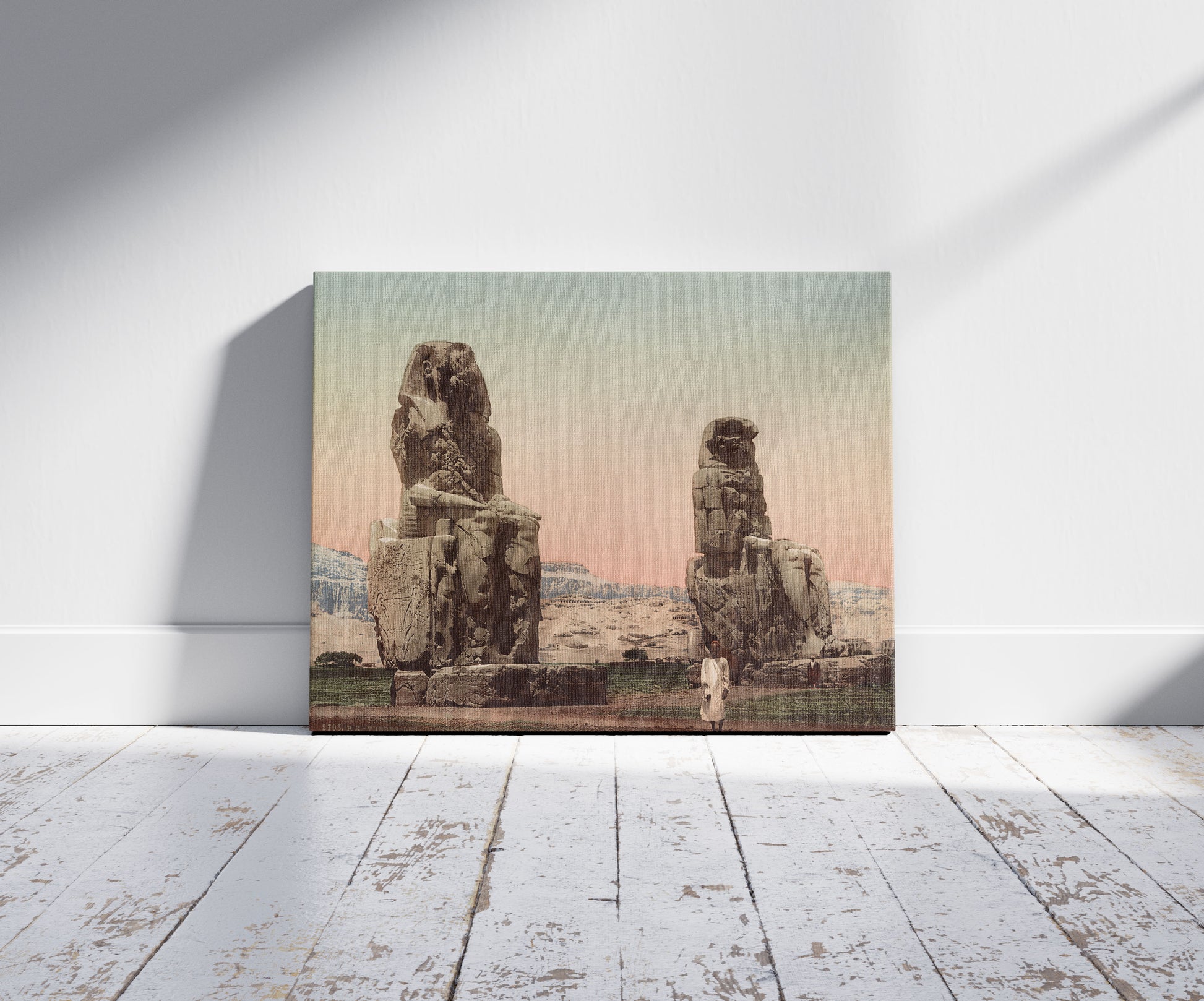 A picture of Thèbes, les Colosses de Memnon, a mockup of the print leaning against a wall