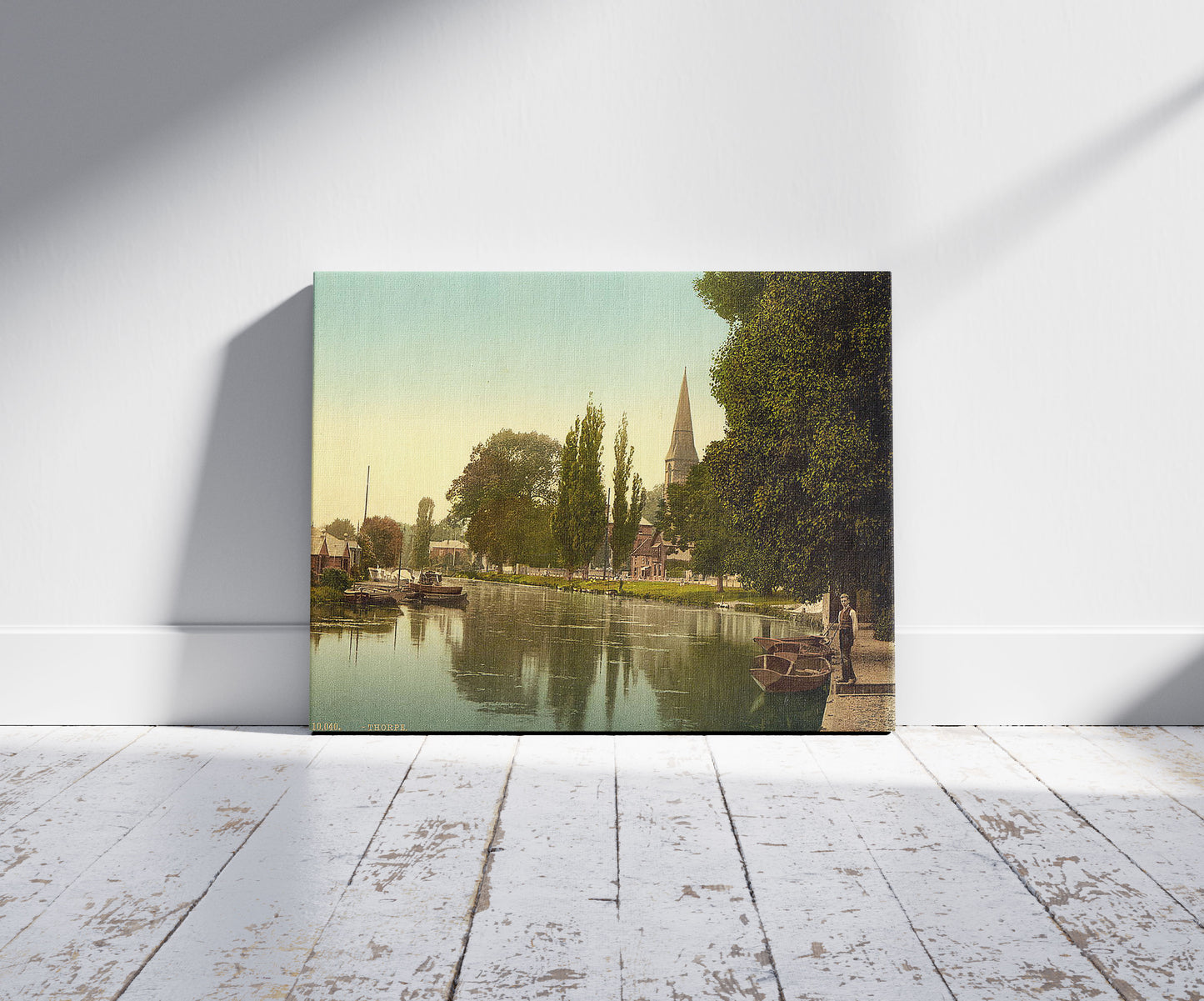 A picture of Thorpe, church and river, Norwich, England, a mockup of the print leaning against a wall